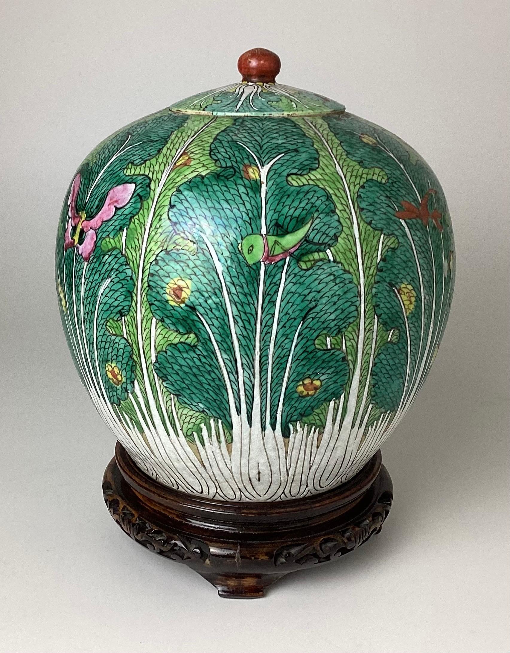 Antique Chinese Famille Rose cabbage decoration covered ginger jar with plinth. Stands 11 1/2
