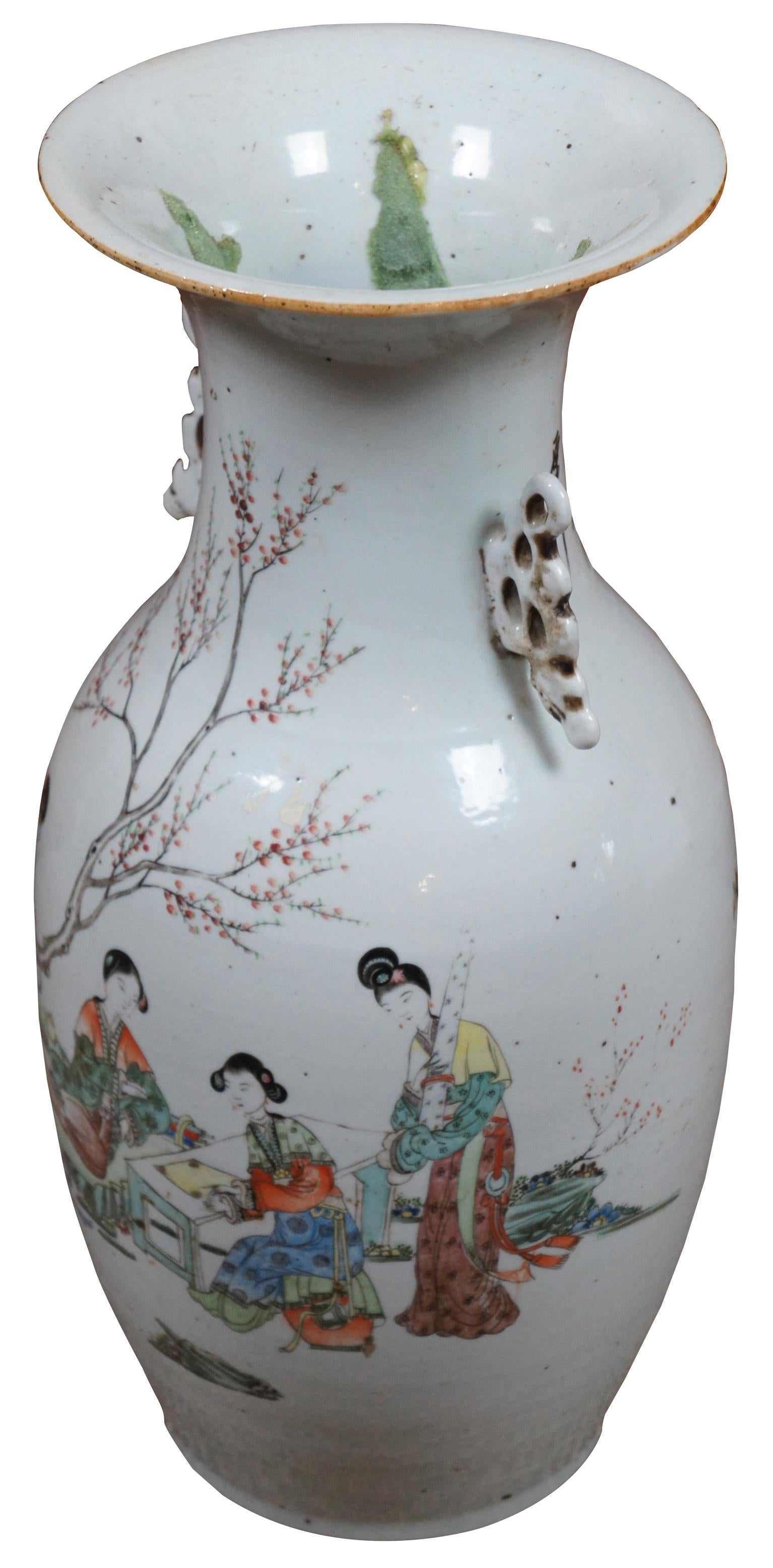 An impressive Antique 19th century Chinese polychrome floor vase with double handles, a scene of geisha figures seated in a garden, and calligraphy on the back. Measure: 17