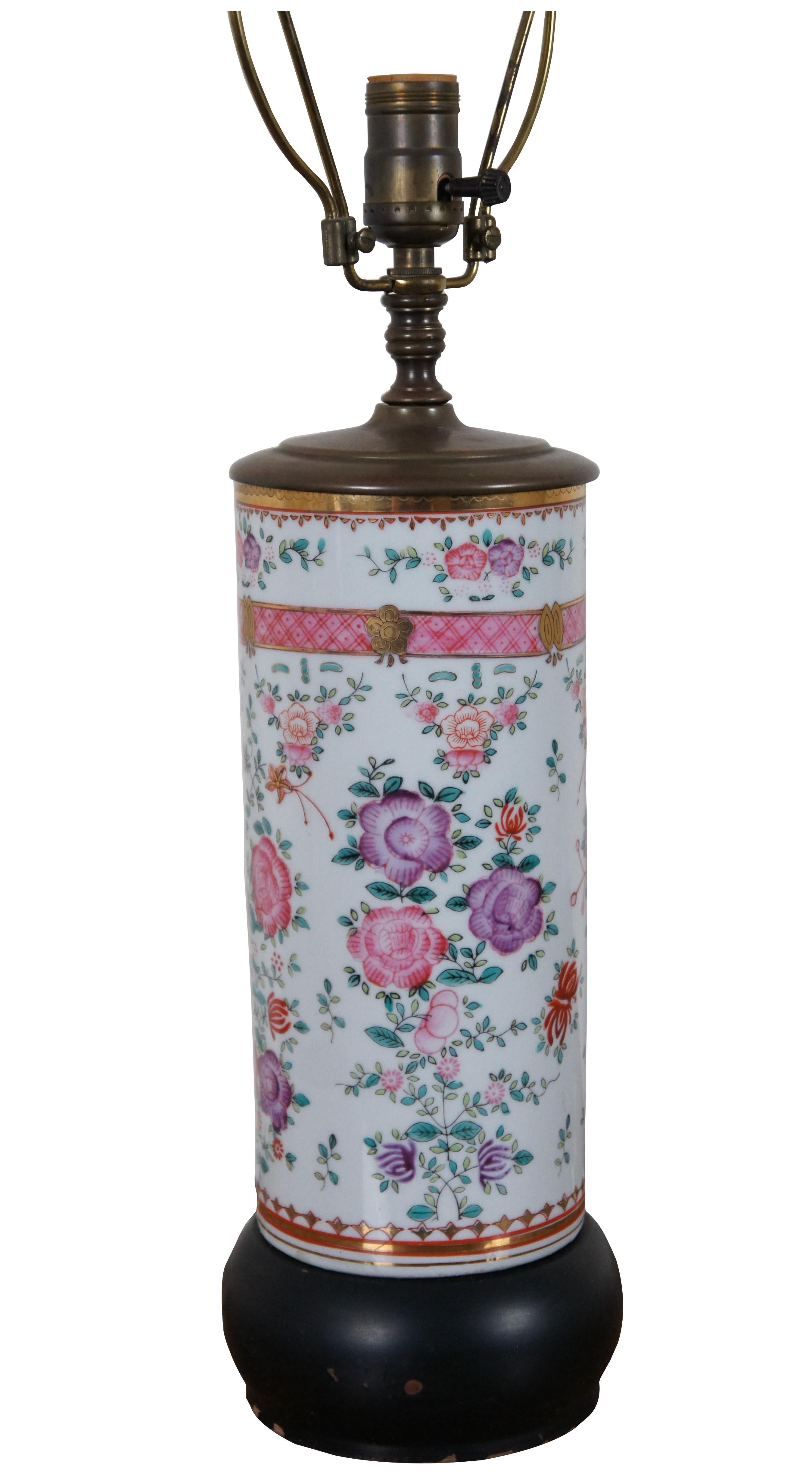 Antique Chinese famille rose porcelain cylindrical vase lamp with wood base and topper, decorated with a design of flowers in pink and purple.

5.5” x 18.75” / Total Height – 28.5”  (Diameter x Height)