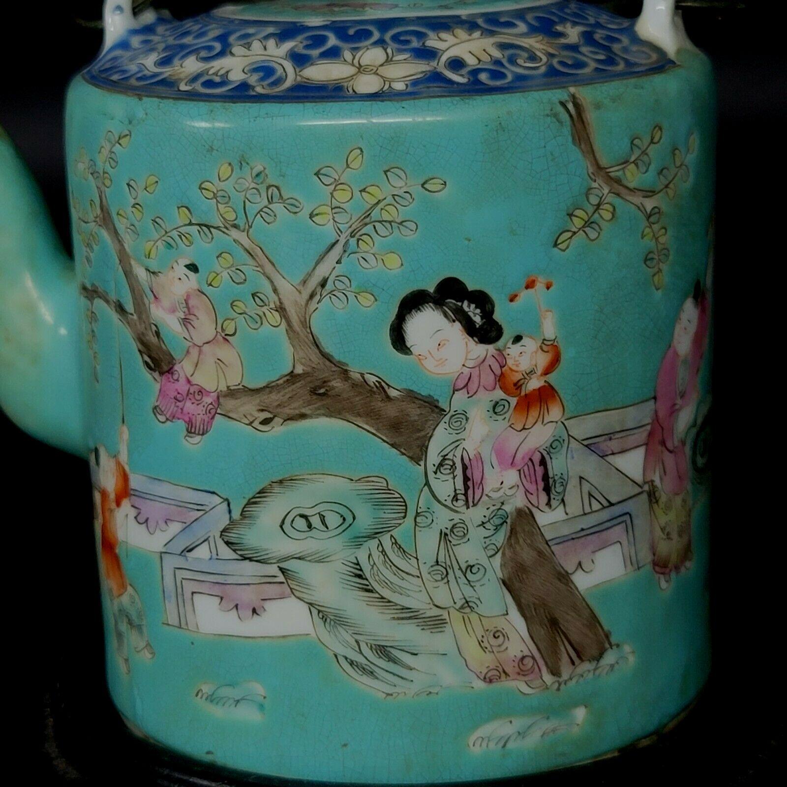 A Chinese Famille Rose Porcelain Teapot with a period stamp on the bottom, depicting the lady with her kids playing in the garden, a mid-19th-century example for a beautiful lifestyle. wood stand included.

  