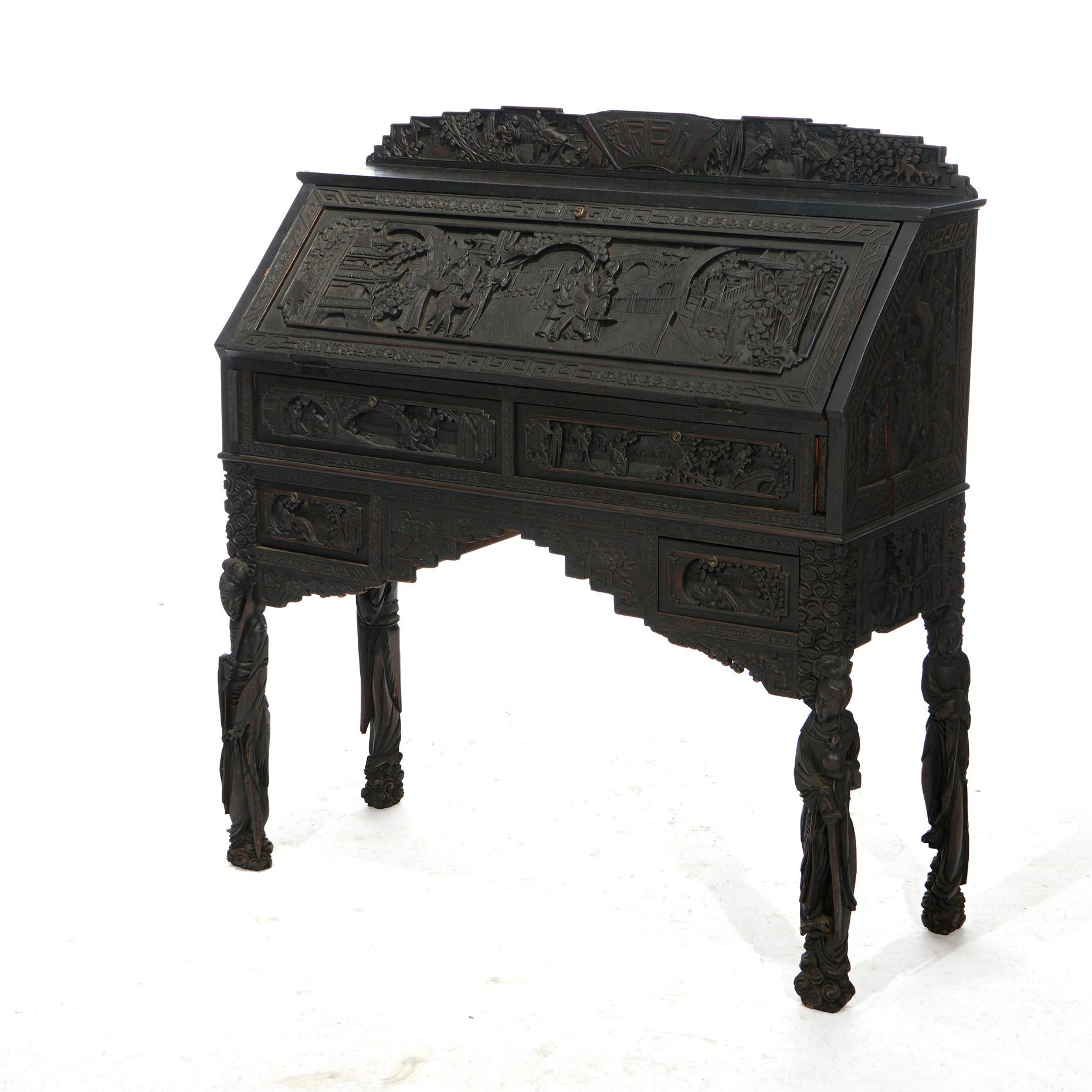 An antique Chinese figural desk set offers carved hardwood construction with drop front desk having deeply carved village genre scenes and opening to interior with pigeon holes over case with four drawers; includes matching deeply carved desk chair,