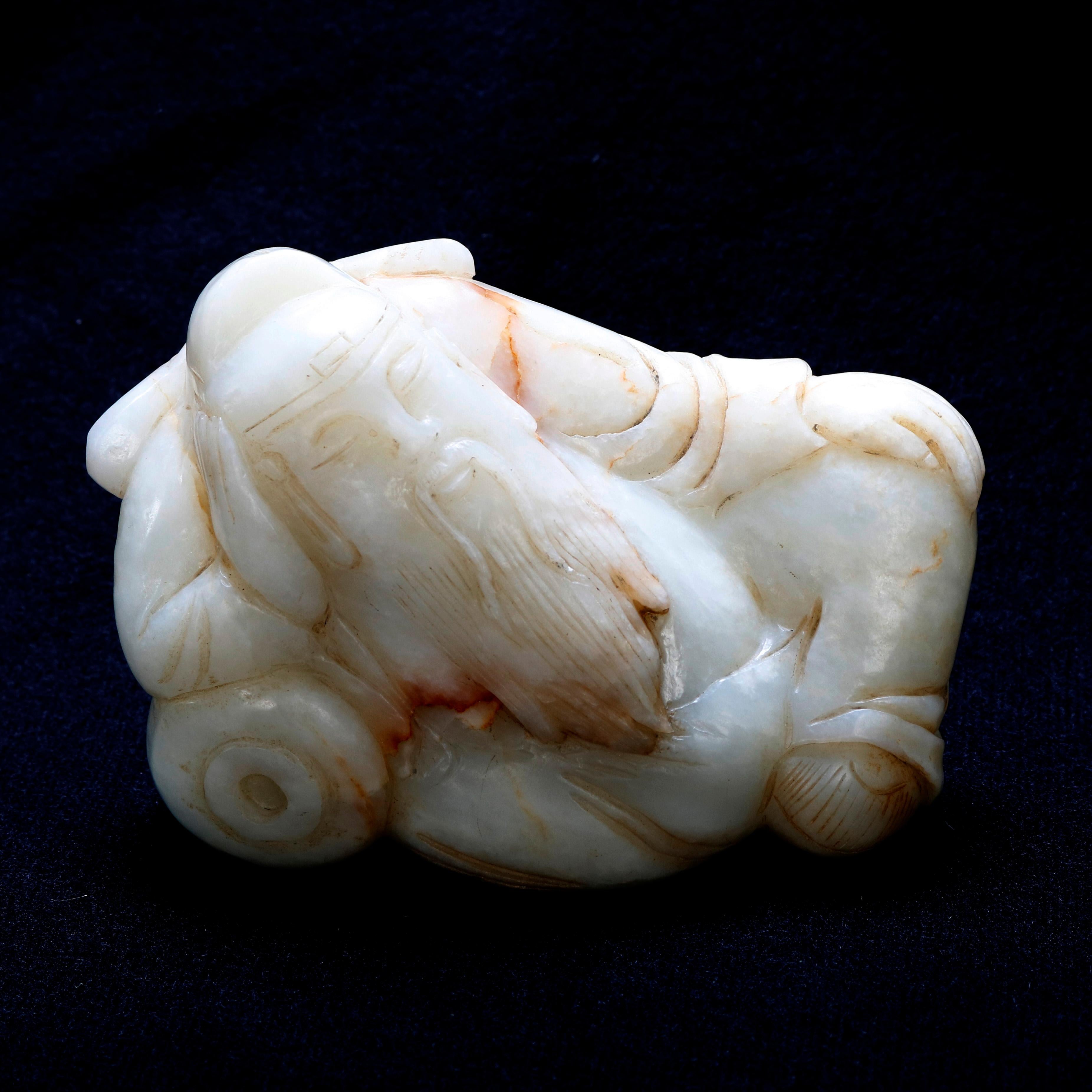 Hand-Carved Antique Chinese Figural Carved White Jade Sculpture of Recumbent Buddha
