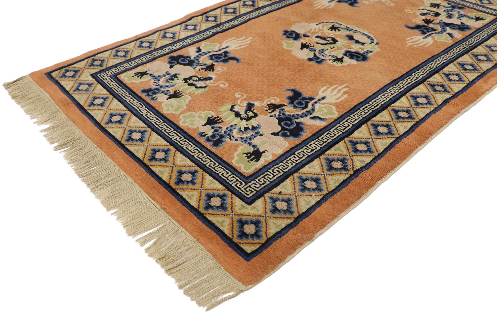 77589, antique Chinese Five Claw Dragon Pictorial rug. This hand-knotted wool antique Chinese pictorial rug depicts a five claw dragon design. The abrashed orange field features an all-over geometric lattice composed of small squares. Taking center