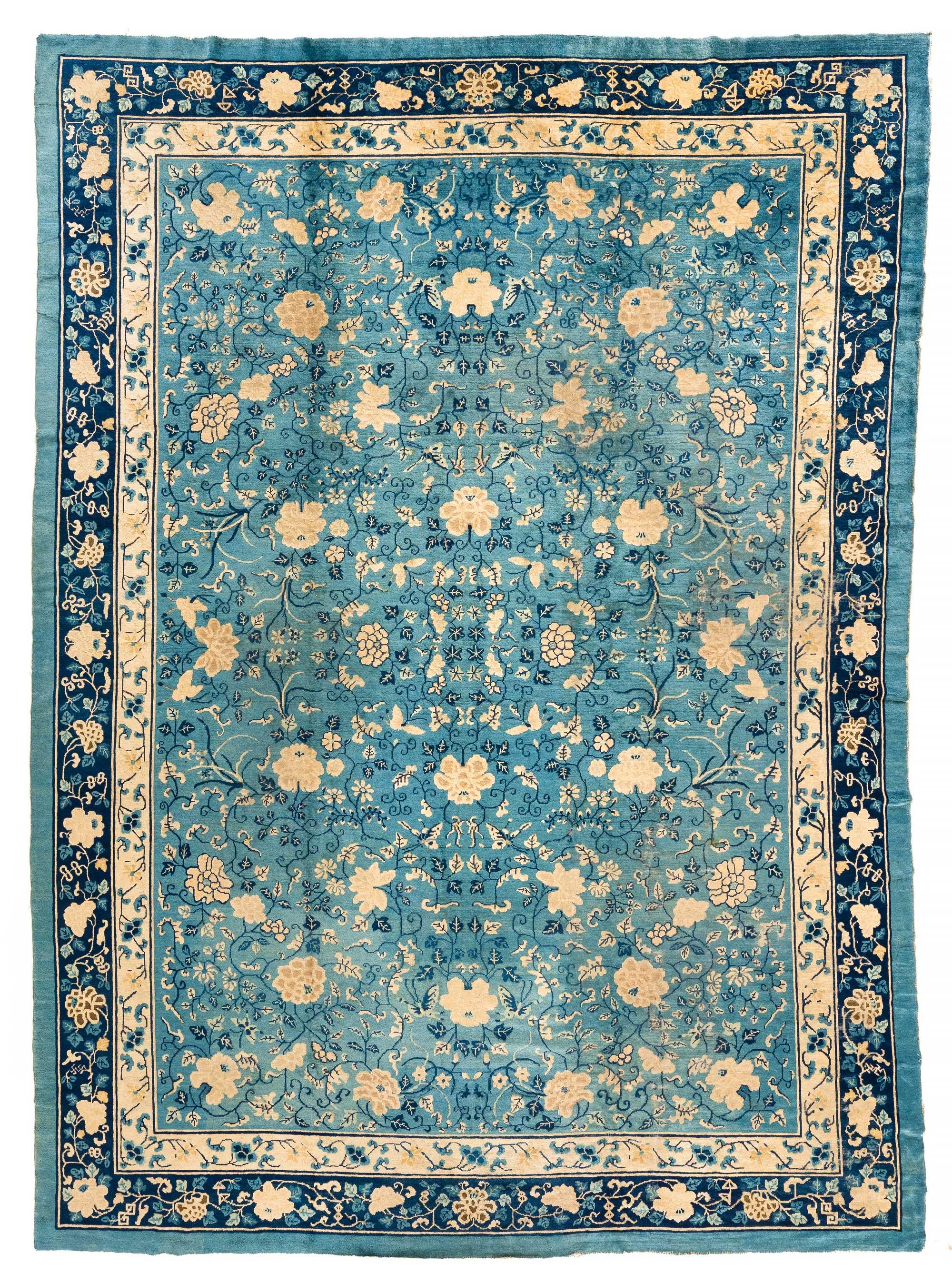 Chinese Export Antique Chinese Floral Rug with an All-Over Design in Blue and Ivory For Sale