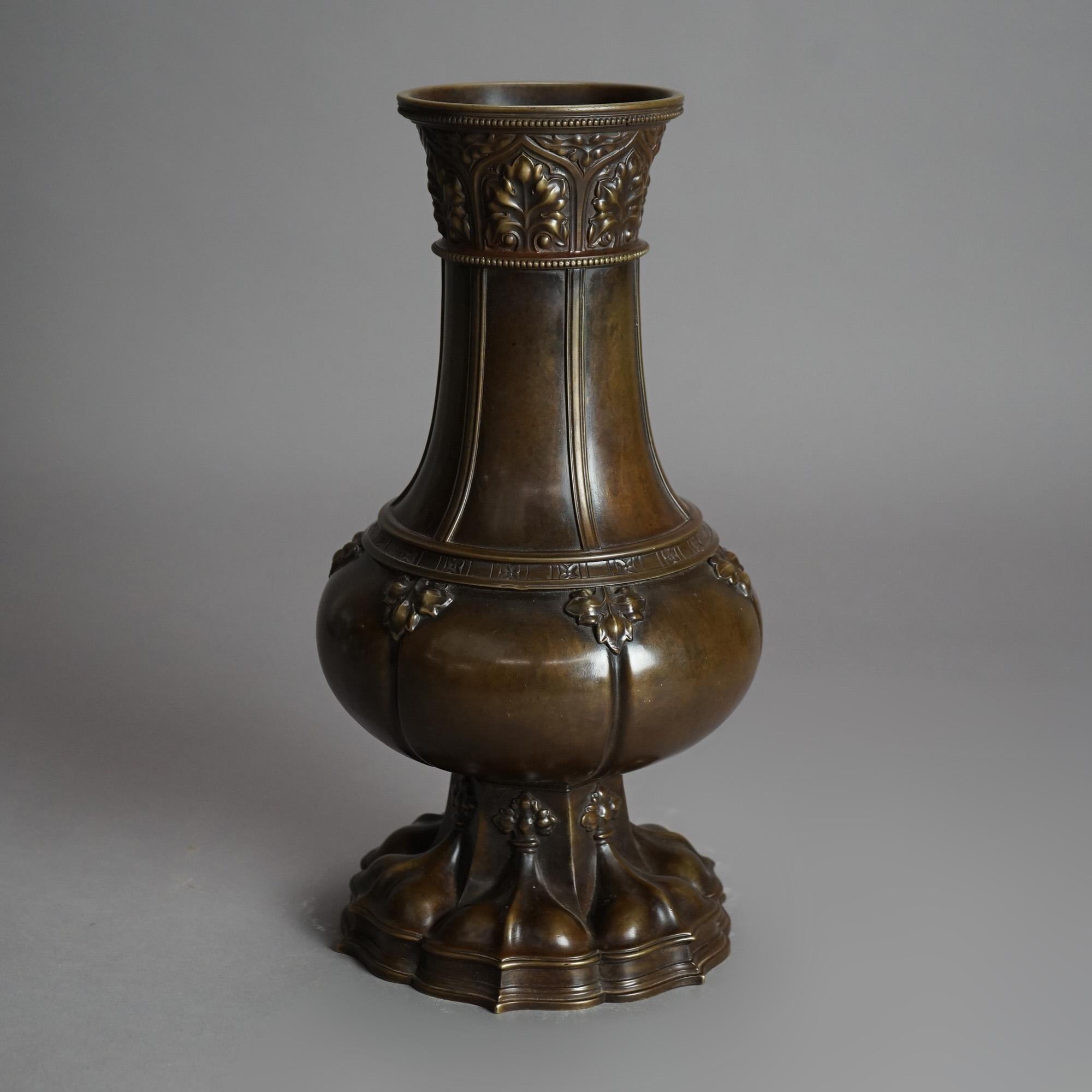 An antique Chinese form vase by Goham offers cast bronze construction with foliate elements, signed, c1900

Measures - 13.5