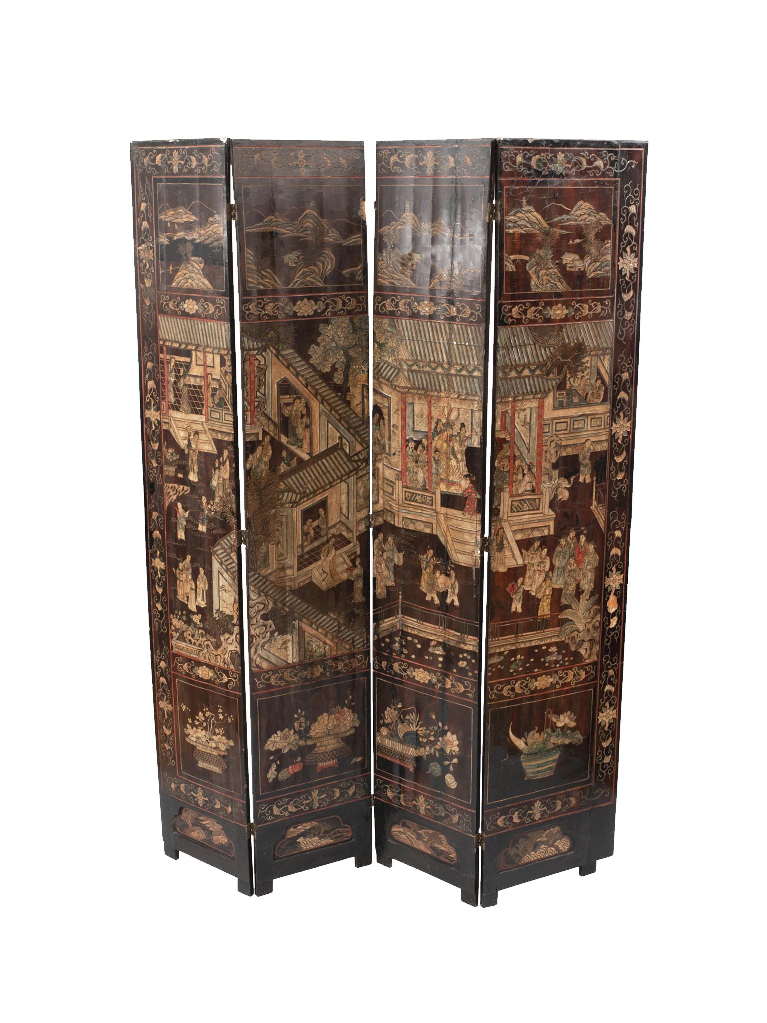 A stunning Chinese folding screen. Handcrafted in the late 19th-early 20th century. The screen is comprised of four hinged wood panels with lacquered coromandel. The panels' design is exquisitely rendered in intaglio and painted in with enamel. What