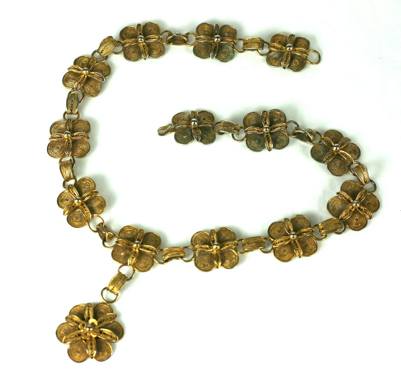 Antique Chinese gilt filigree silver necklace from the early 20th Century. Quatrefoil stations with floral centers form the links of the necklace with a large gilt floral pendant drop. 1930's Chinese. 19