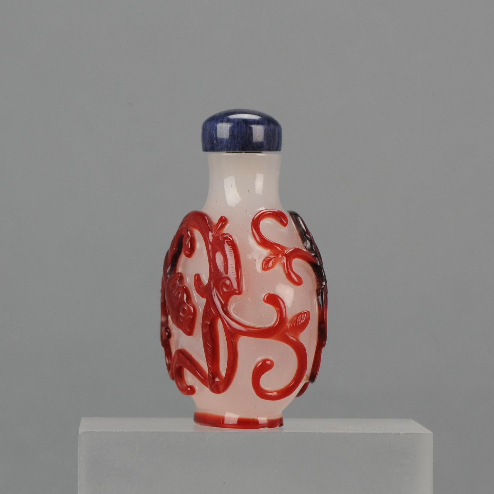 An lovely 18th-19th century snuff bottle with red overlay. Probably palace workshops

Provenance Collection Morpurgo Amsterdam

Condition

Overall condition good, but a chip from the baserim. Size: Without stopper 60mm. With stopper