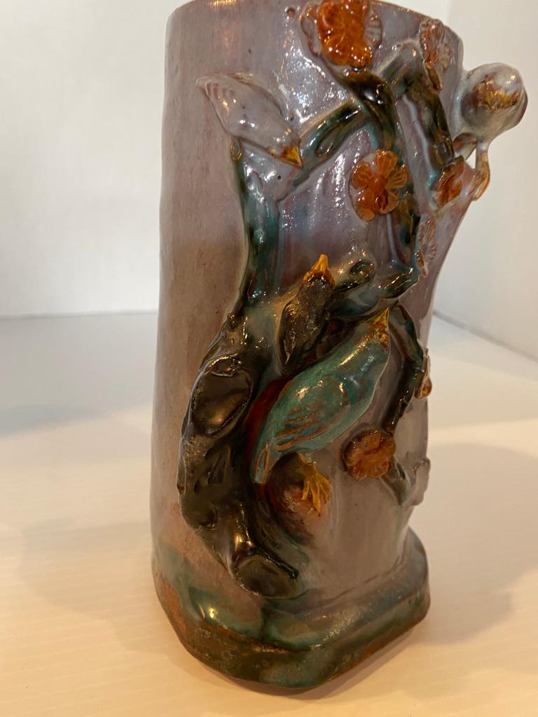 This antique glazed brush pot also came from a collection. Having lite purple background and applied birds surround on a cherry branch Add to your collection.