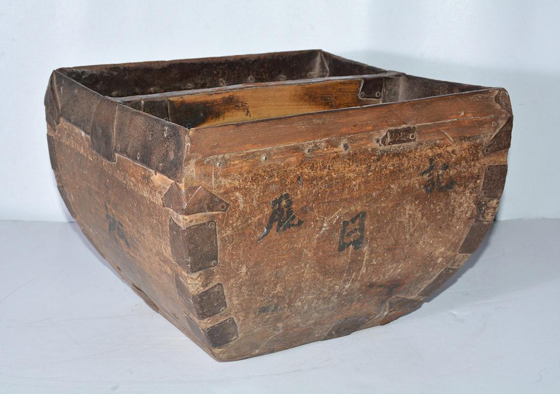 Chinese rice or grain measure or water bucket showing very attractive wear and Chinese calligraphy. These boxes are not only beautiful they are very functional. Classically shaped with original iron fittings. Many practical uses including, firewood