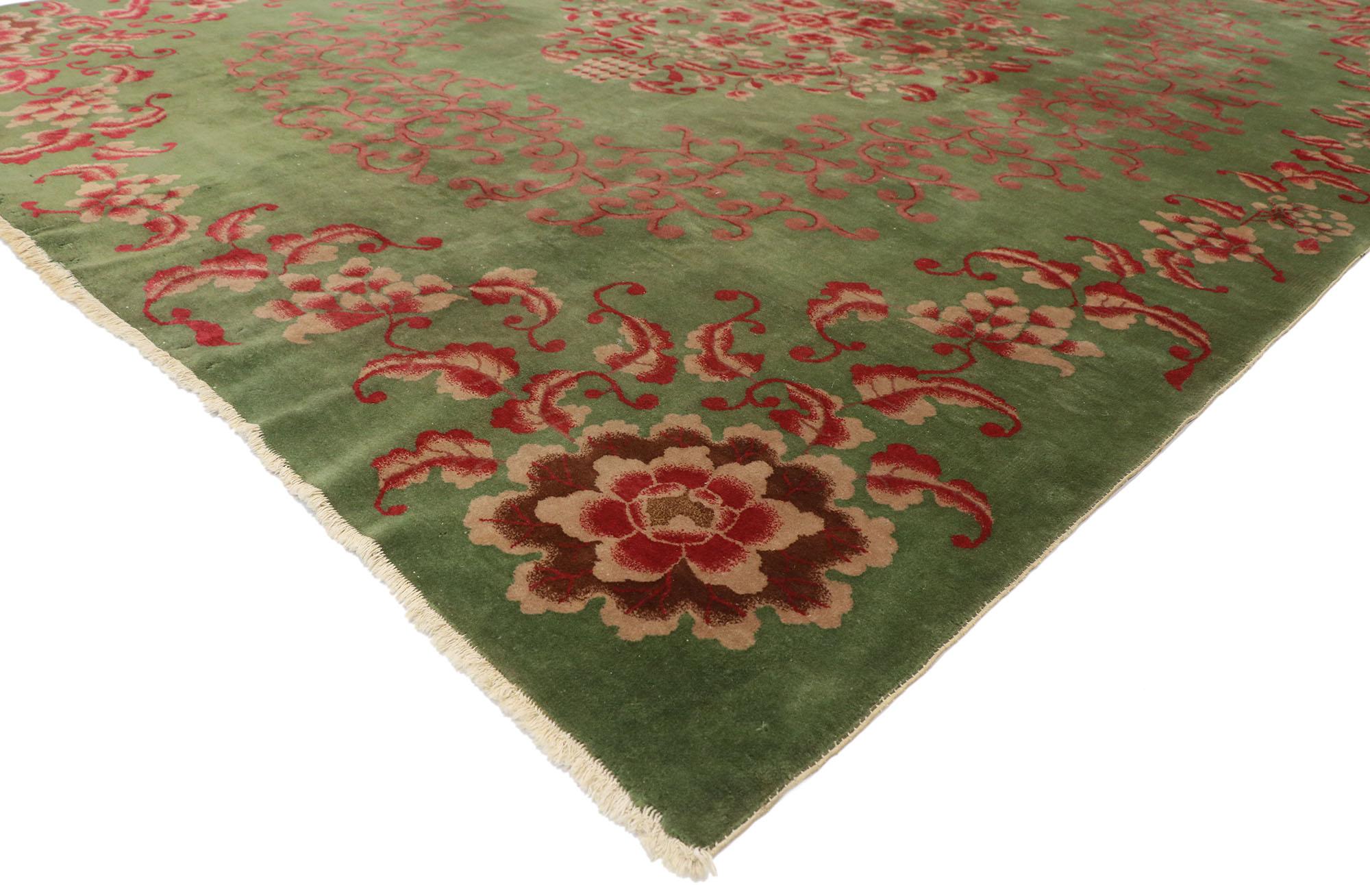 77624, antique Chinese green Art Deco Rug with Qing dynasty style 09'00 x 11'04. This hand-knotted wool antique Chinese Art Deco rug features a rounded open center medallion decorated with Chrysanthemum, peonies, cherry blossoms, lotuses, and leafy