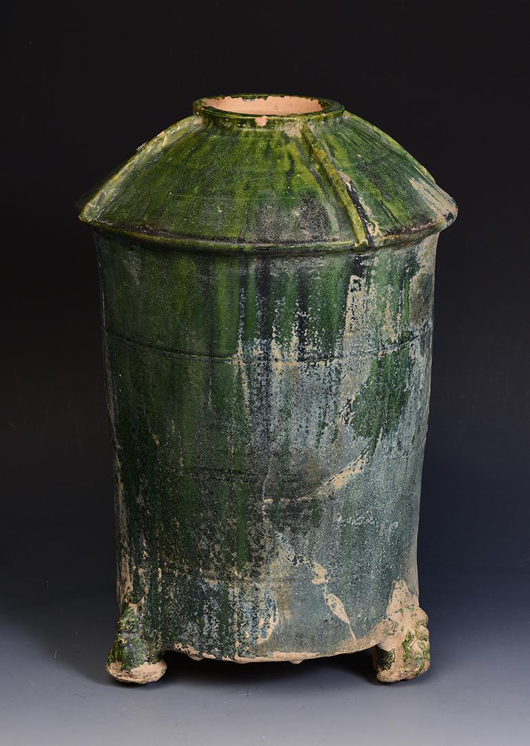 Chinese green glazed pottery granary jar with silver patina.

Age: China, Han Dynasty, 206 B.C. - A.D. 220
Size: Height 32.6 C.M. / Width 21.7 C.M.
Condition: Well-preserved old burial condition overall with some amount of soil adhering.

100%