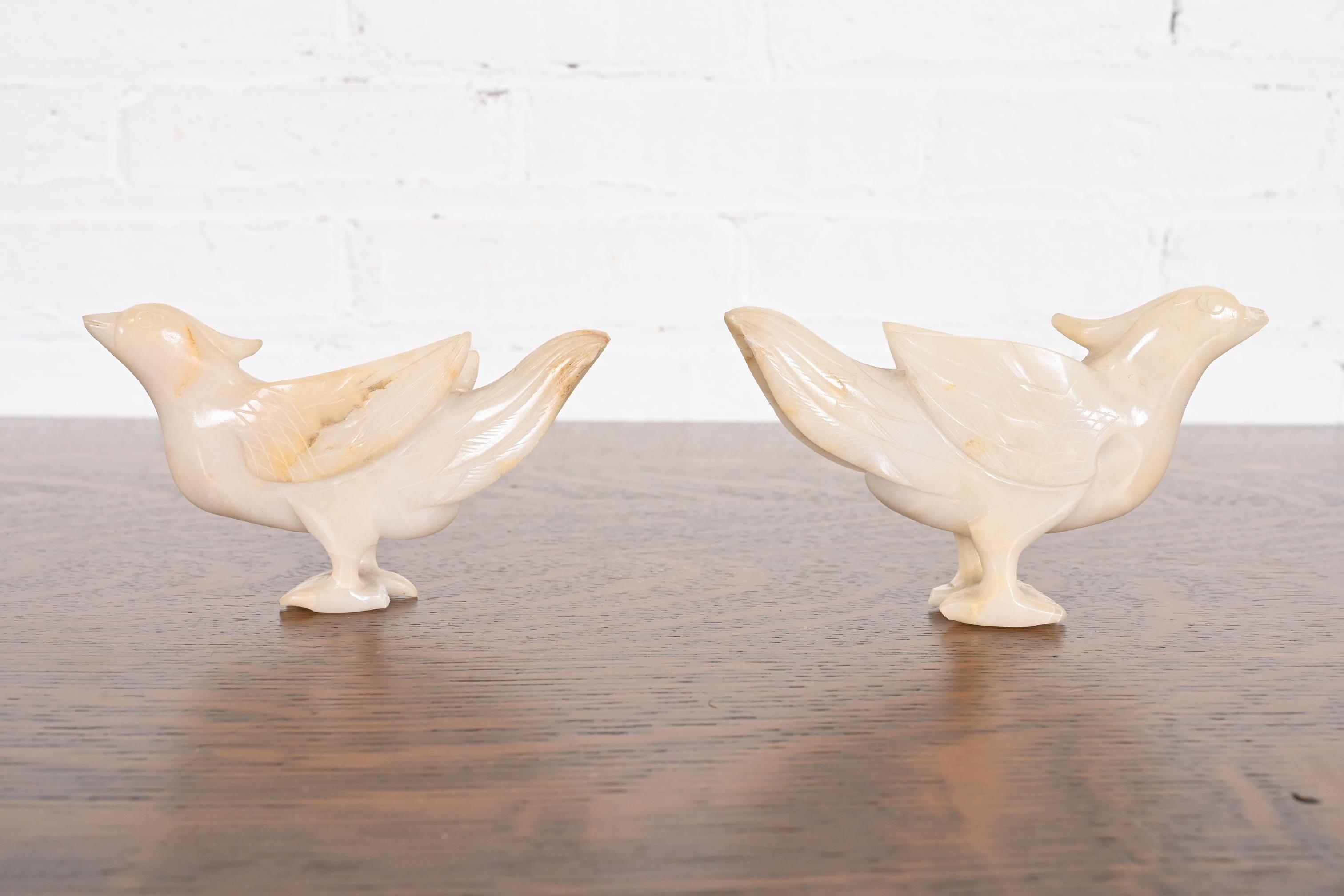 A gorgeous pair of antique hand carved white jade bird figures

China, Early 20th Century

Each measures: 5.38