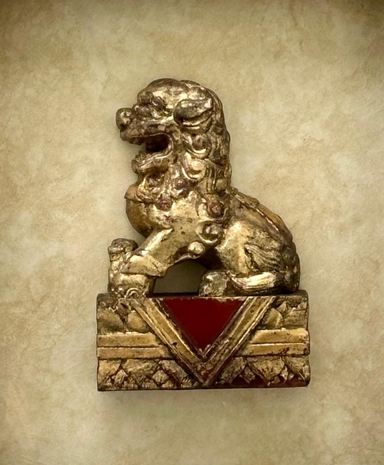Antique Chinese Hand Carved Wood Gilt Foo Dog in Shadow Box.

Chinese shadow box features a hand carved wood and gilded Foo Dog from the Qing Dynasty. It is mounted in a massive and deep contemporary shadow box matted under glass. The large