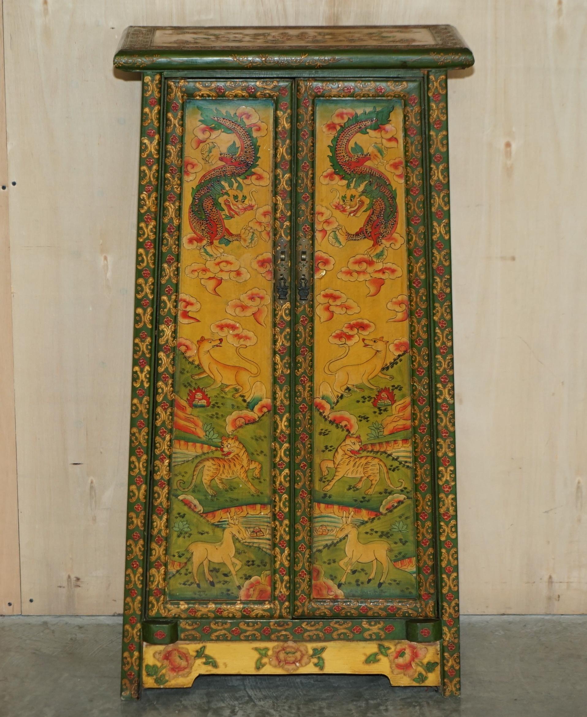 We are delighted to offer for sale this lovely antique circa 1920 hand painted and lacquered Chinese side cupboard depicting dragons and early rural animals 

A very good looking and well made piece, these are now highly collectable as art