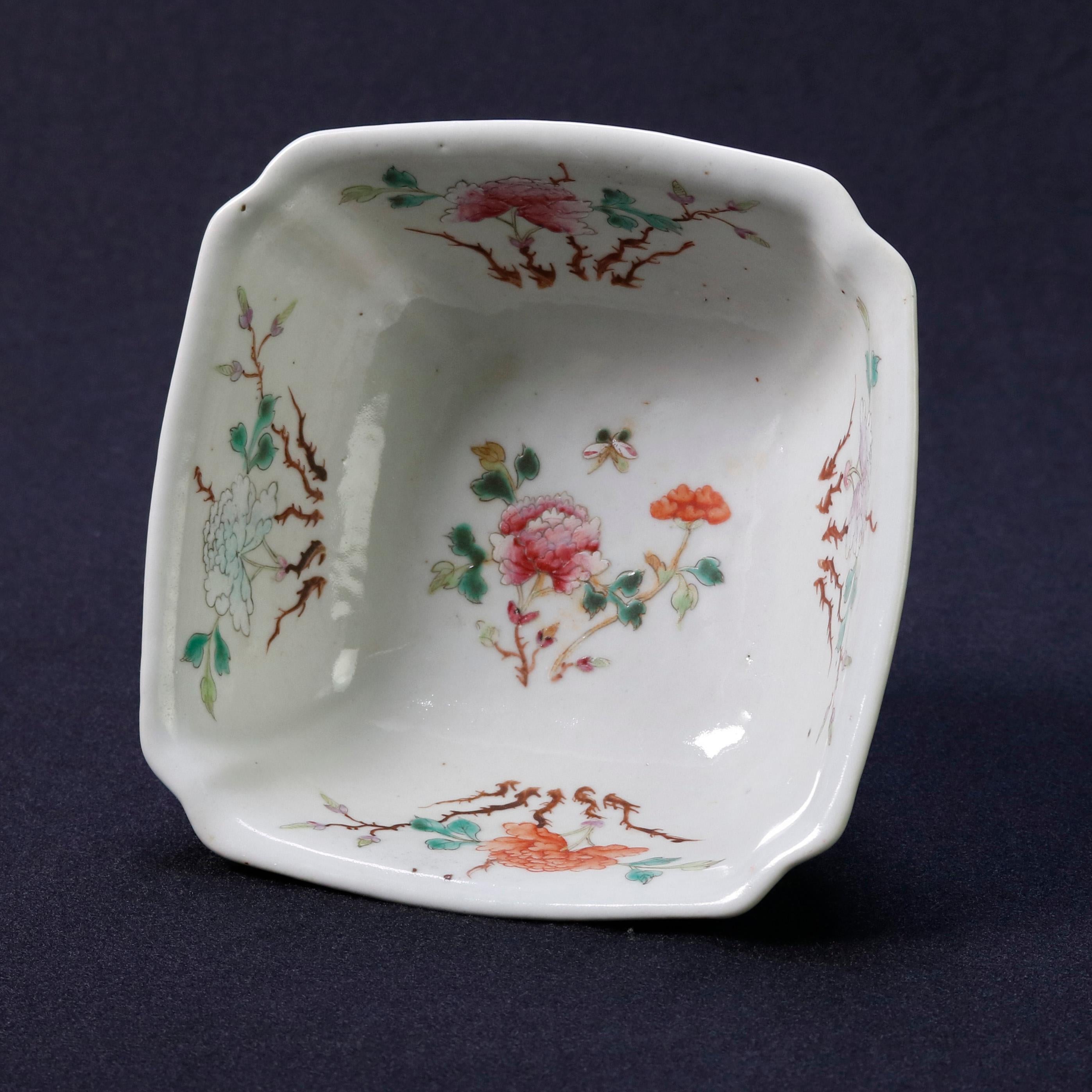 An antique Chinese celadon hand decorated porcelain bowl offers clipped corner square form with all-over floral exterior decoration and hand painted interior floral reserves, seated on squat and flared foot, signed on base as photographed, 19th
