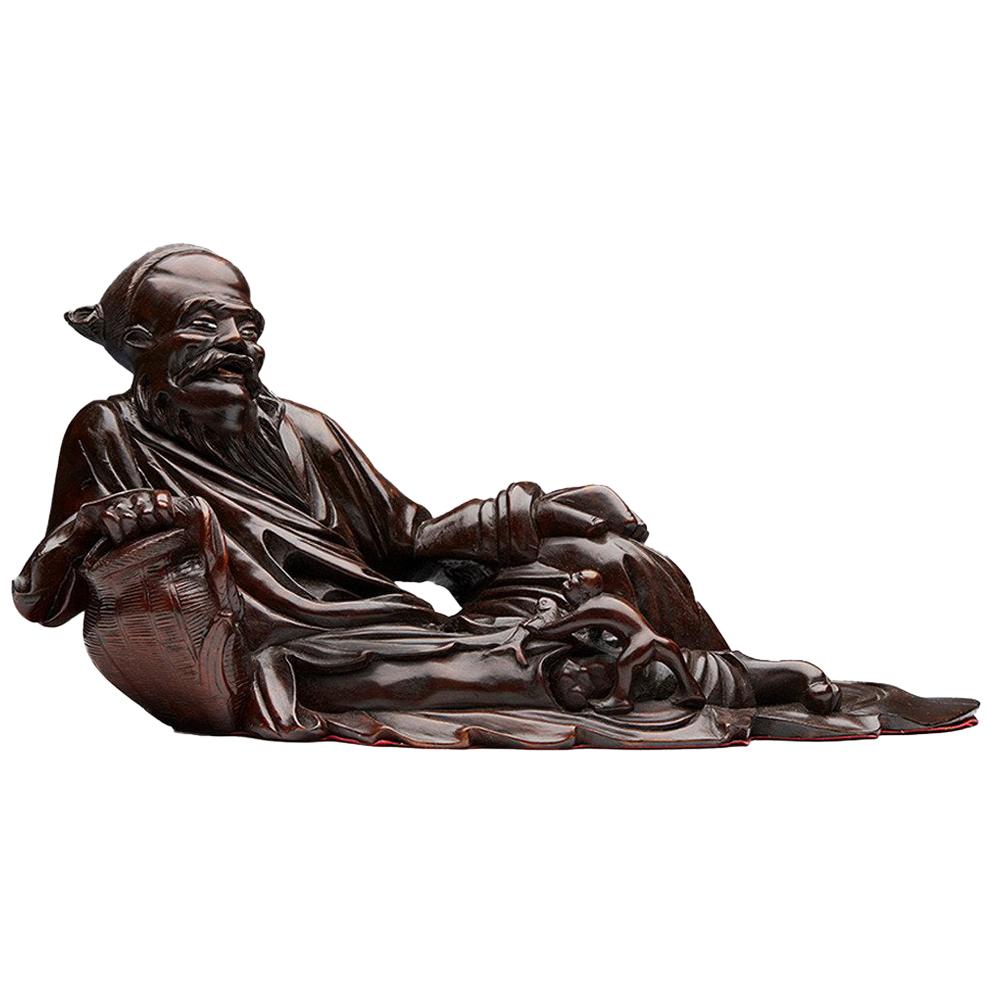 Antique Chinese Hardwood Reclining Immortal Figure, Early 20th Century For Sale