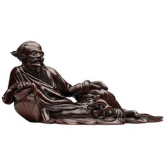 Antique Chinese Hardwood Reclining Immortal Figure, Early 20th Century