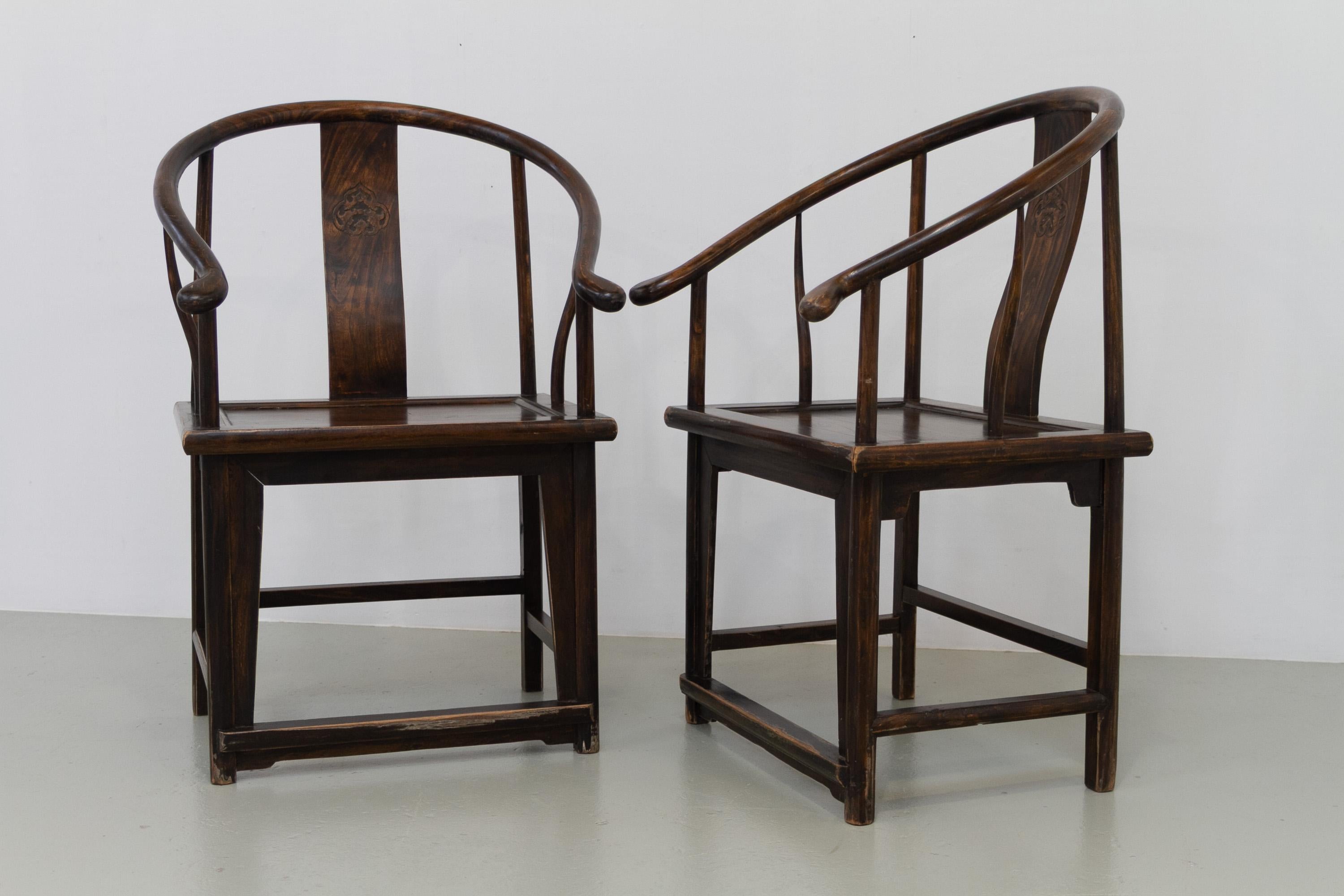 Antique Chinese Horseshoe Armchairs, 1890s. Set of 2.

Also known as roundback chairs this wonderful matching pair of large and elegant Chinese chairs features horseshoe shaped armrests and dragon carvings from the late 19th century. Made from solid