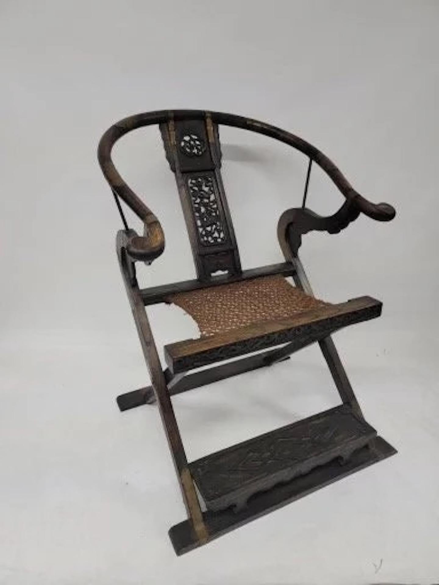 Antique Chinese Huanghuali Horseshoe Back Folding Throne Chair

This Chinese Huanghuali brass mounted folding horseshoe back Jiaoyi armchair. The arms and rail are elegantly formed in one continuous curve, terminating with hand rests swept outward.