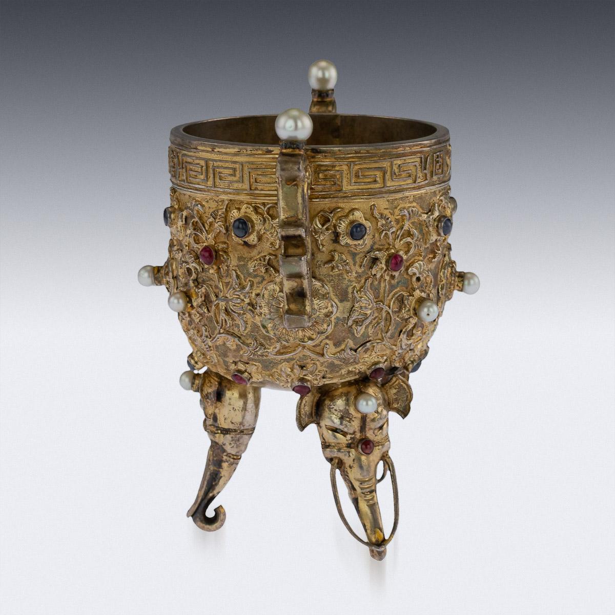 Antique late 19th century Chinese exceptionally rare copy of the 'Emperors gold wine cup'. The original gold cup has an upright mouth and a round body. It is made in the ding style with a tripod for its base. The body is covered with interlocking