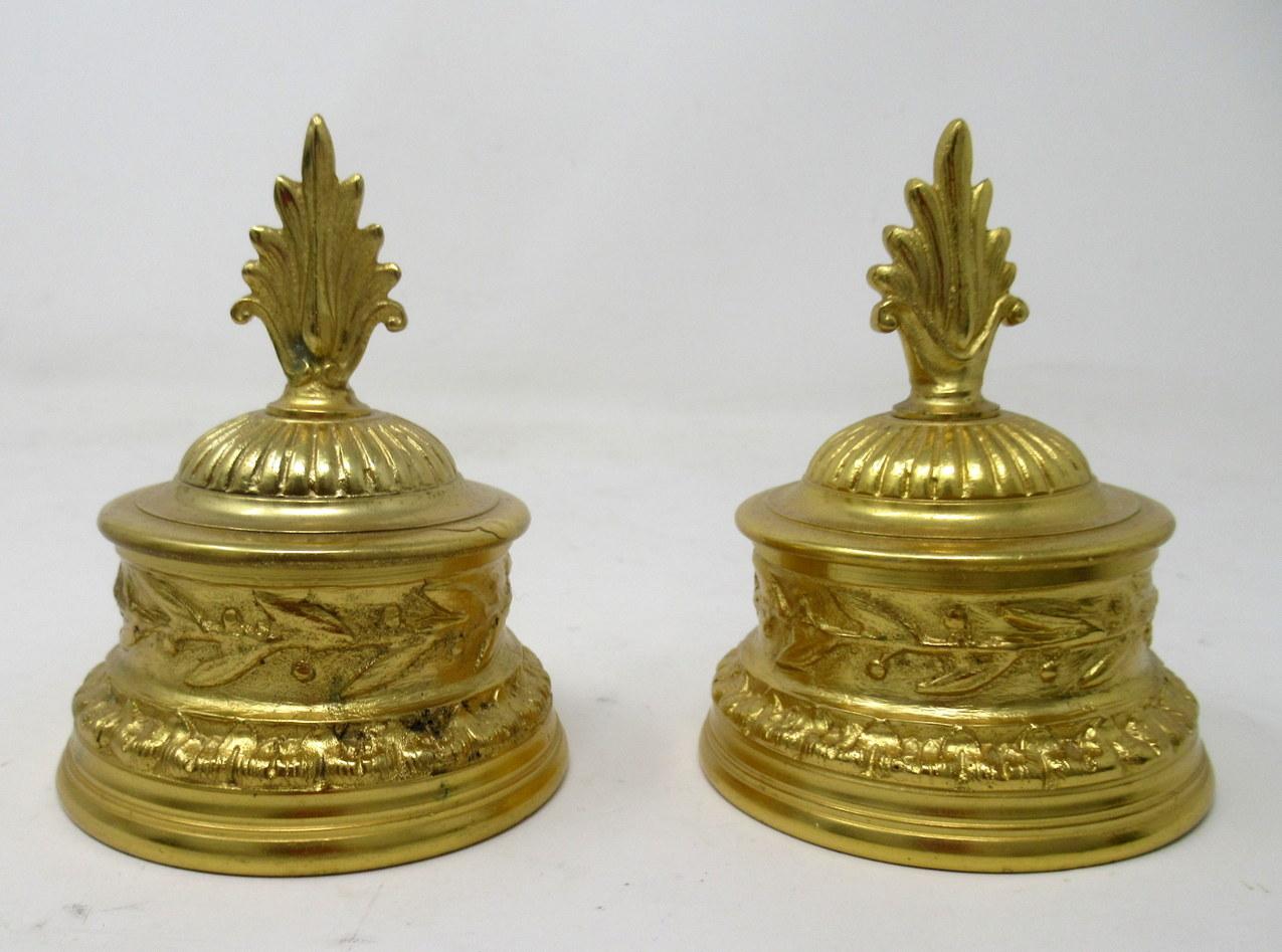 Very stylish patinated bronze desk inkwell modelled as a bust of a Chinese or Japanese figure wearing a straw hat, together with a pair French ormolu Inkwells. Both items are late 19th century.

The male bronze figure wearing ring earrings and a