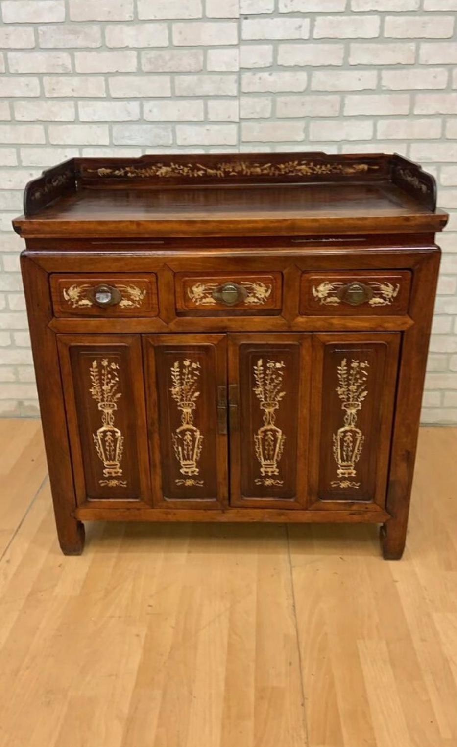 Antique Chinese Jiangsu Province Rosewood with Bone Inlay Sideboard Cabinet

Exceptional 1800's Chinese Jiangsu province cabinet with bone inlay, beautifully crafted from rosewood and nanmu wood. The drawers and doors of this antique sideboard are