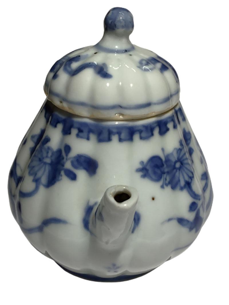 white and blue teapot