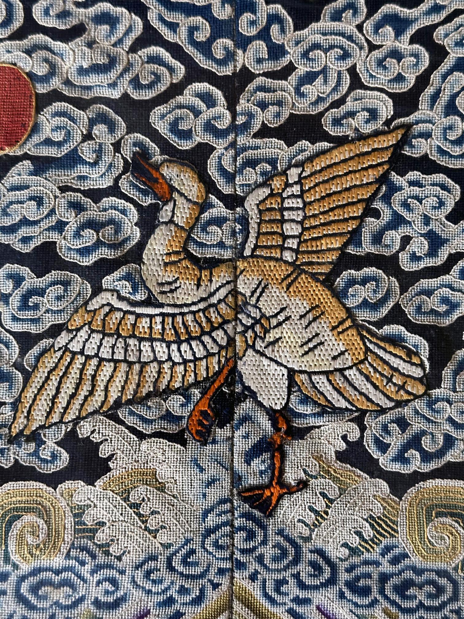 A fine silk kesi civil rank badge panel (known in Chinese as Buzi) framed and glazed. The fourth rank panel feature borders of fret archaic key and are centered by the insignia bird wild goose, which is the symbol of the fourth rank civil official