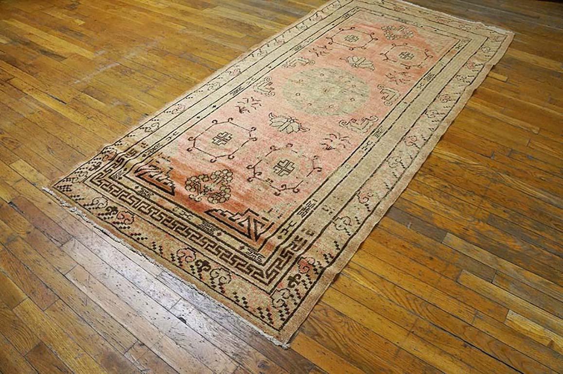 Early 20th Century Central Asian Khotan Rug with an soft coral background and yellow patterned border.
( 4' x 8' - 122 x 245 ) 