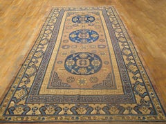 Significant Camel Color with Small Medallion Design Antique Khotan Rug