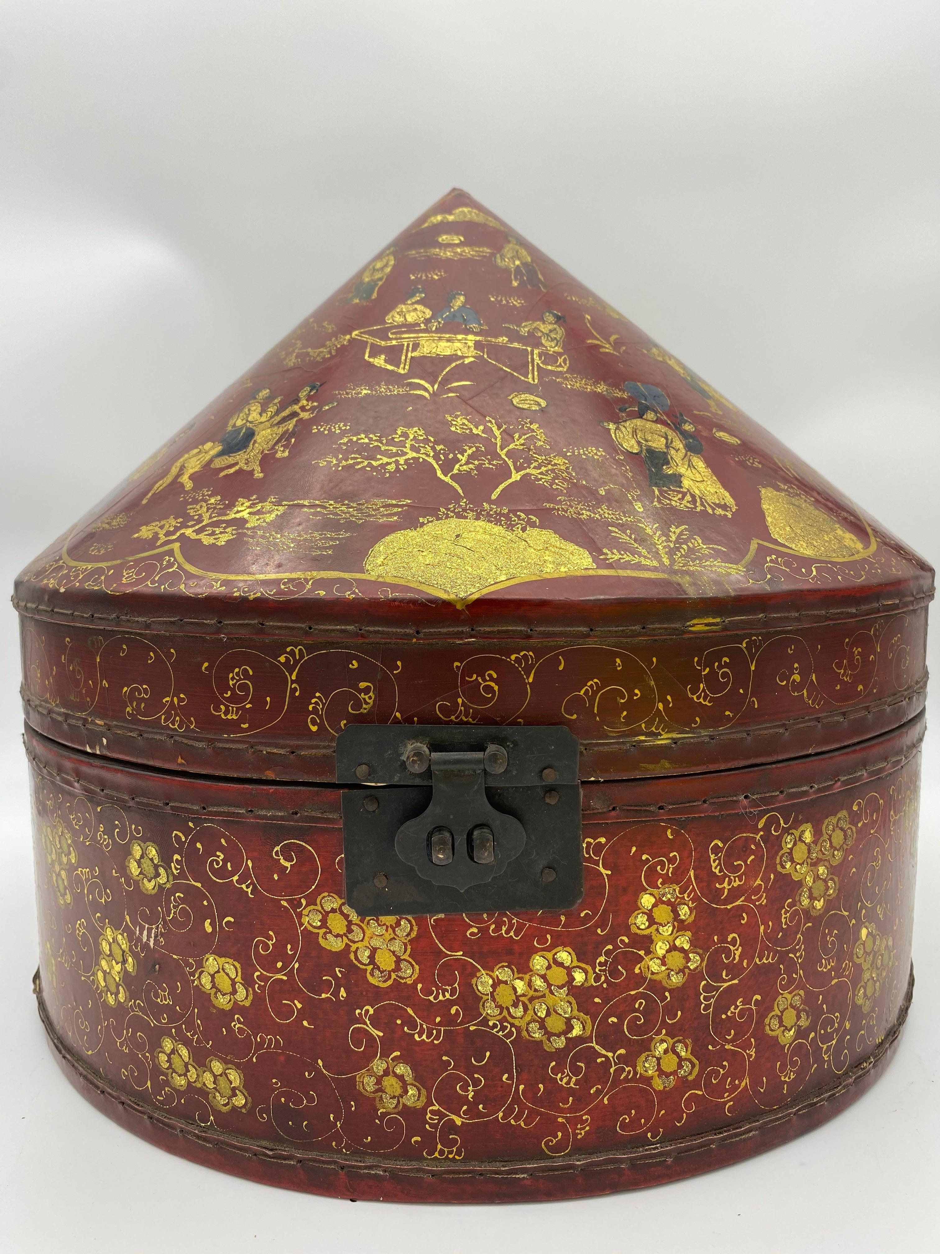 Antique Chinese lacquer leather hat box with gold paint.