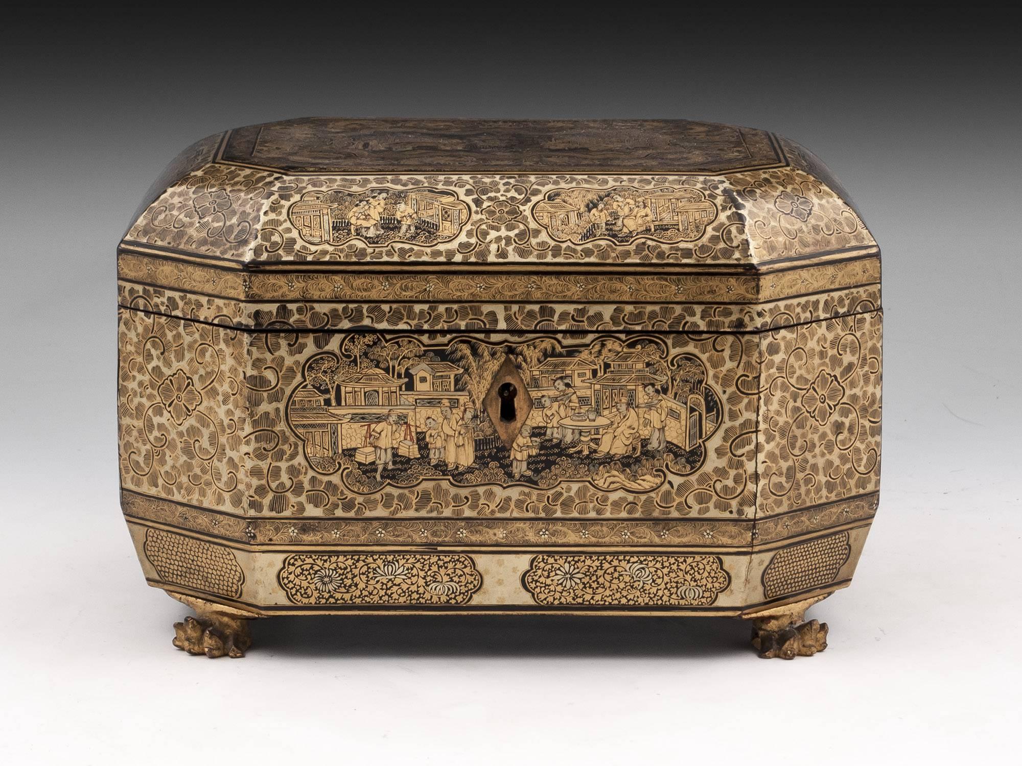 Chinese lacquer tea chest standing on four carved dragons feet, decorated with beautiful very detailed chinoiserie panels.

The Chinese tea caddy has a fully working lock and tasselled Key.