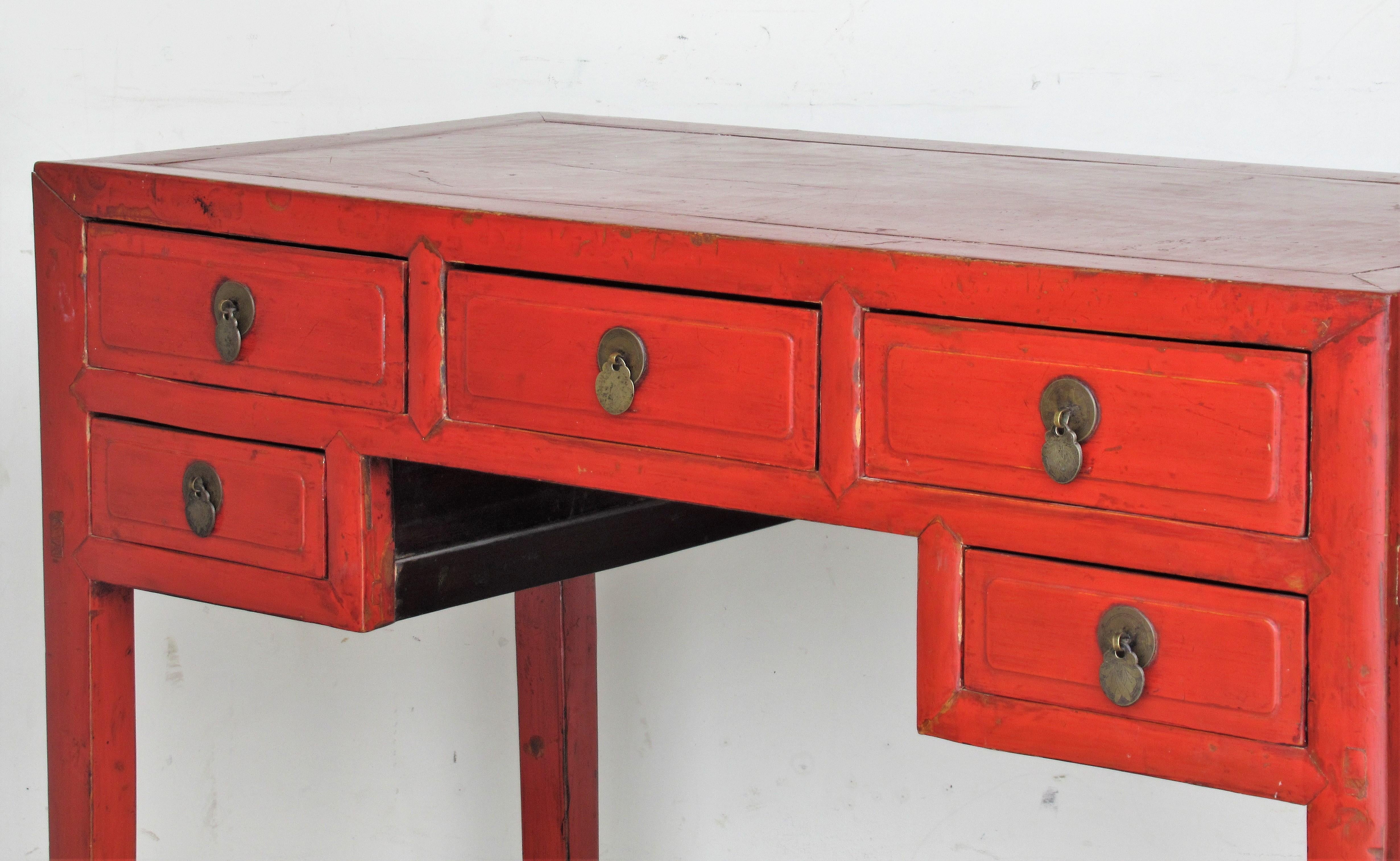 Antique Chinese mandarin red lacquered console table server with five deep drawers / fine brass hardware. dovetailing at rear of drawers / tenon construction on case. Overall beautiful aged surface color. Circa 1900-1920. Look at all pictures and