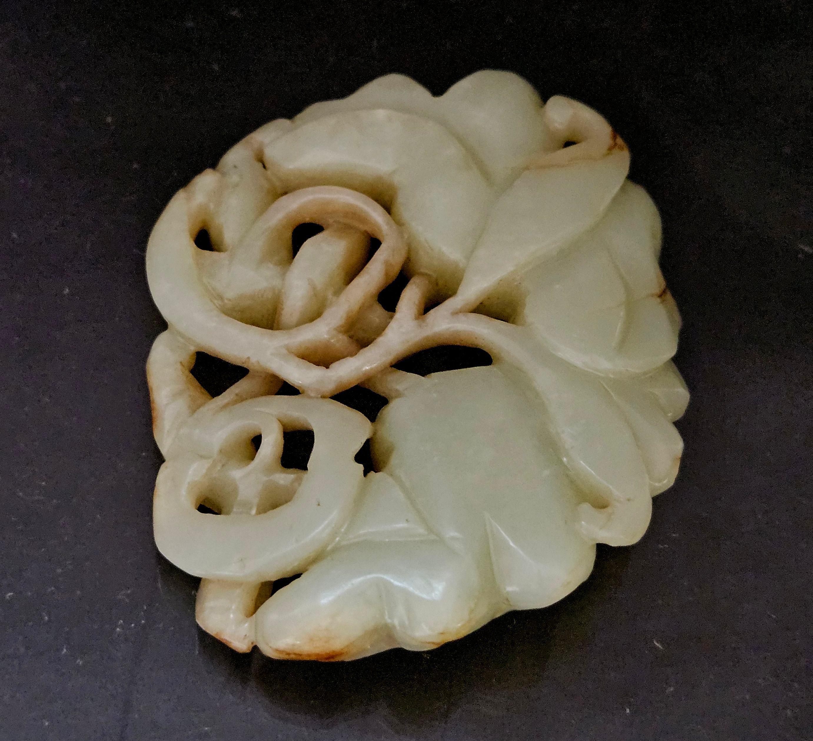 A nice hand-carved antique, Chinese Celadon Jade Pendant depicting floral and lotus carving with 3D detailed presentation.

