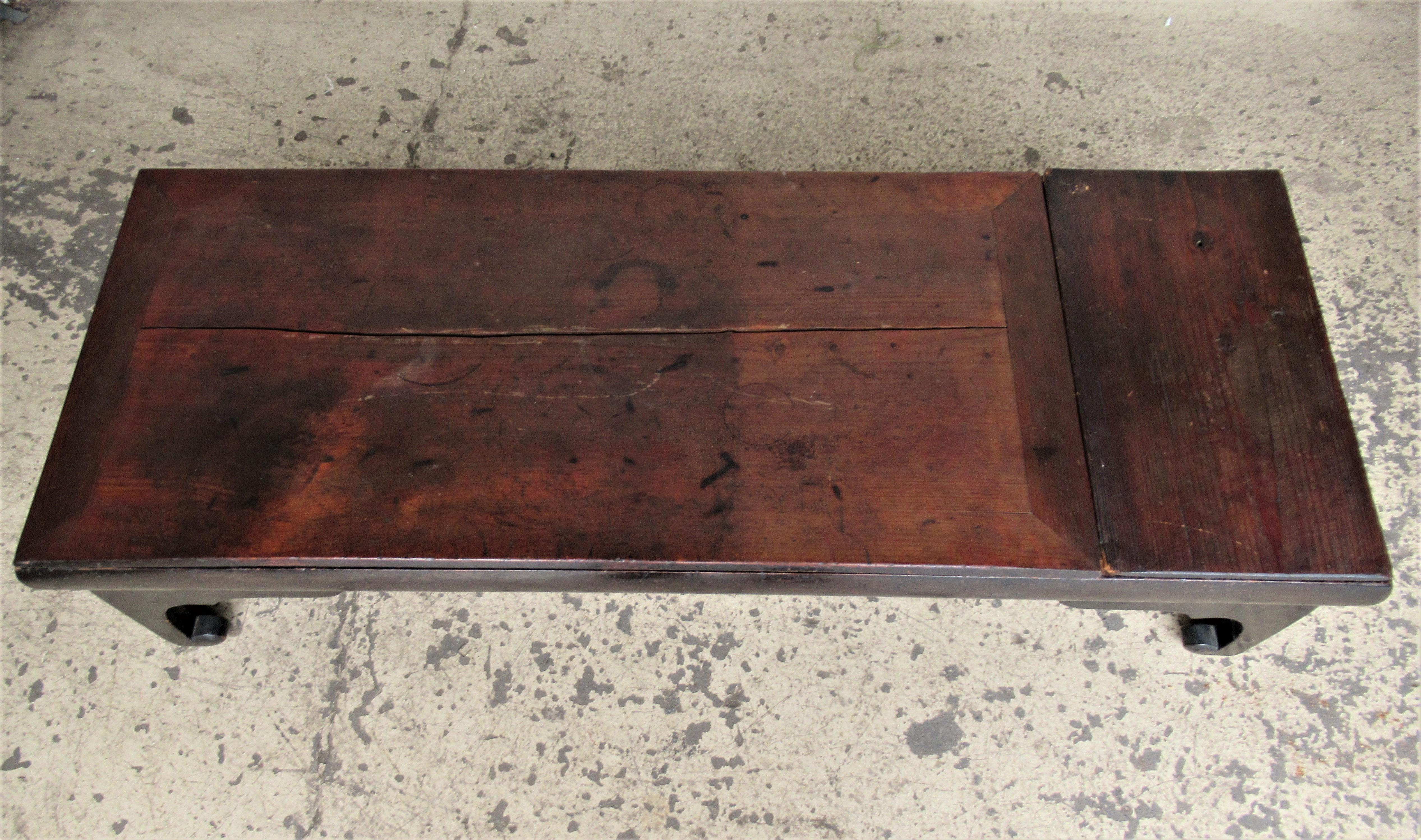 Antique 19th century Chinese low table / coffee table with an incredibly beautiful archaic form and nicely aged original color and great old surface. Two board top is removable / the base with divided interior compartments. Look at all pictures and