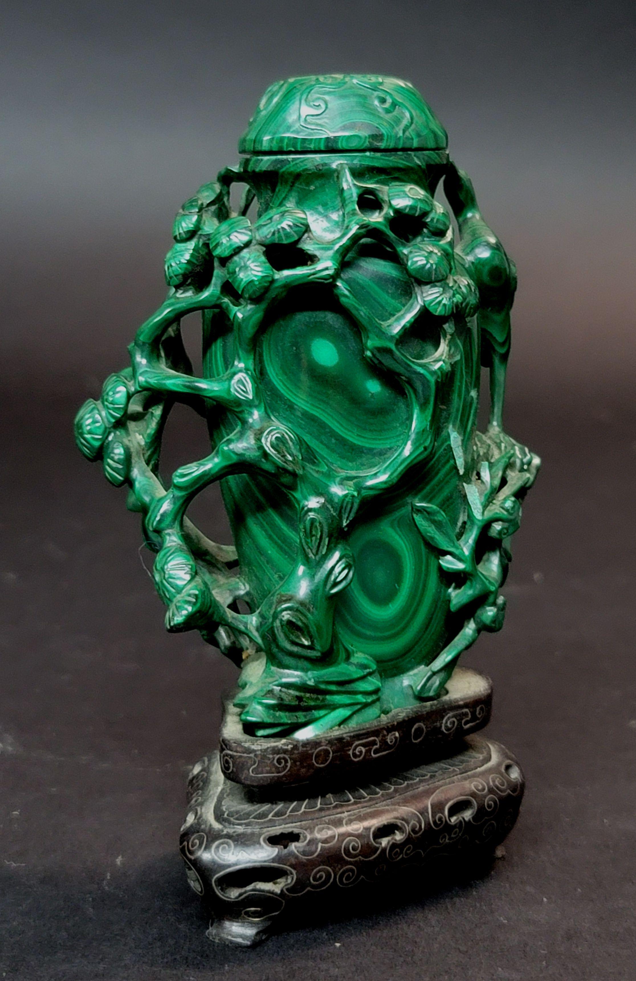 A fine hand carved antique Chinese malachite carvings: a vase with lid and pine tree with crane (bird), very intricated carving with wire inlaid wood stand. Size: H: 4 1/2