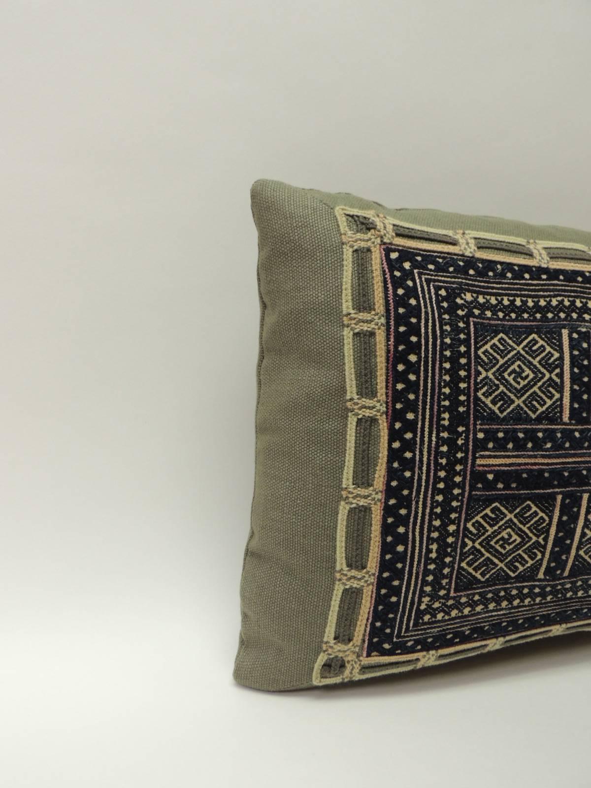 This item is part of our 7Th Anniversary SALE:
Centre multi-color woven panel embellished with a framed moss green linen, 
same linen textile used as backing. Throw bolster pillow decorated with a 
small woven cotton trim applied all around.