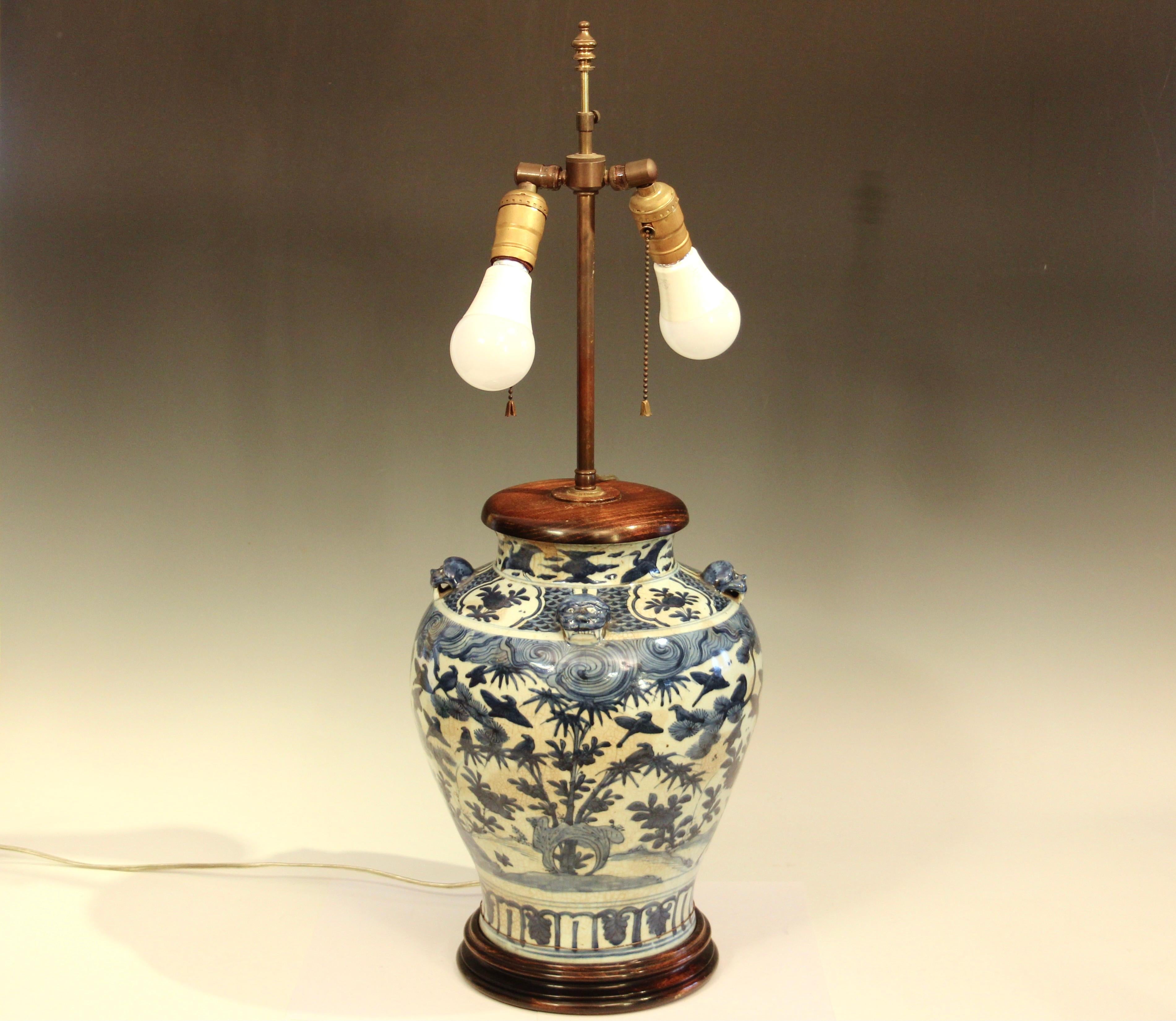 Antique Chinese late Ming porcelain blue and white vase converted to a lamp. Bold design with good color. Monster masks at the shoulder. Circa 17th century. Shade not included. Excellent working condition, piece of mouthrim missing, filled with