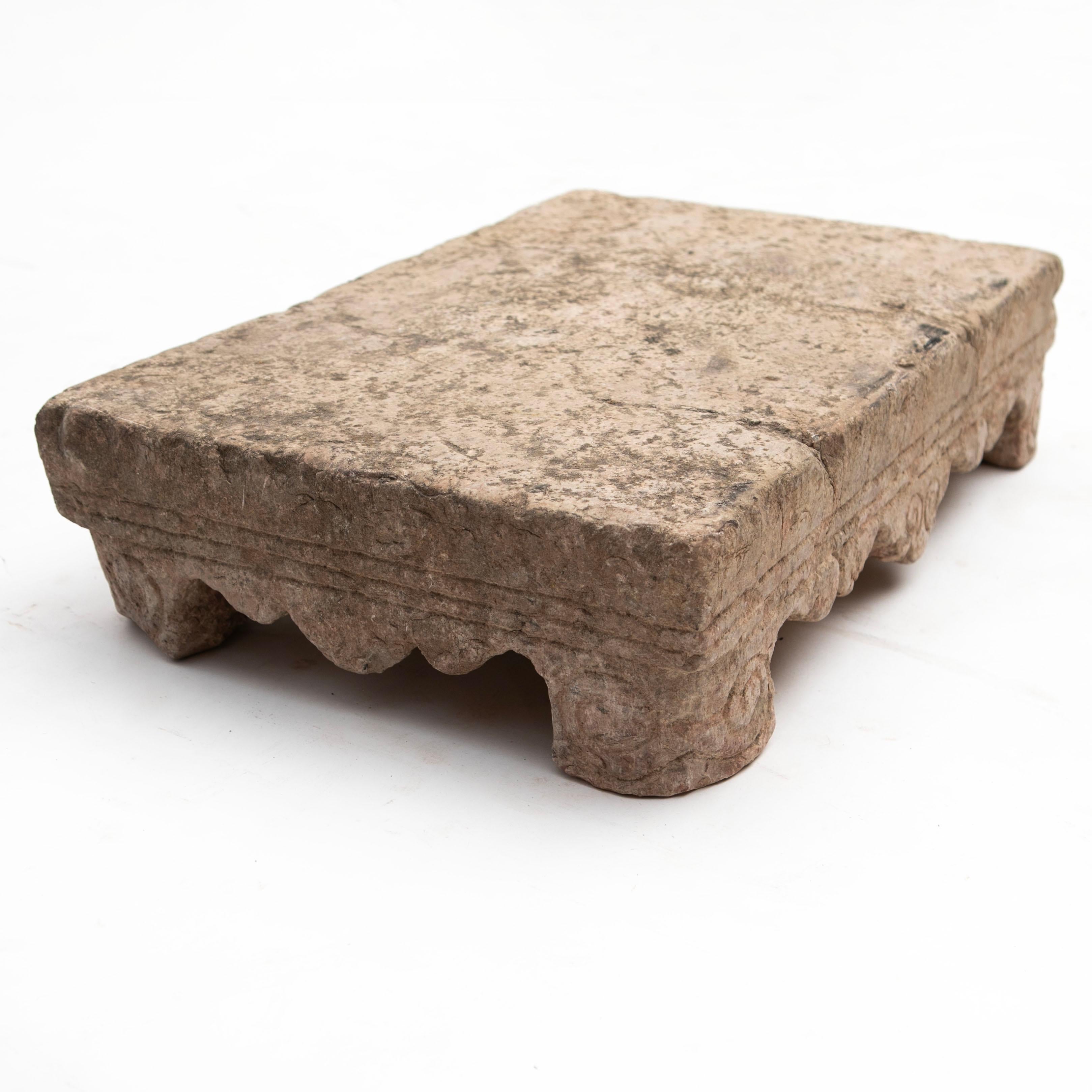 A Chinese 16-17th century Ming stone table carved from a solid piece of stone. This table has a traditional scalloped apron and legs ending in scrolled feet.

In well-preserved original condition with natural patina, it serves as an ideal pedestal