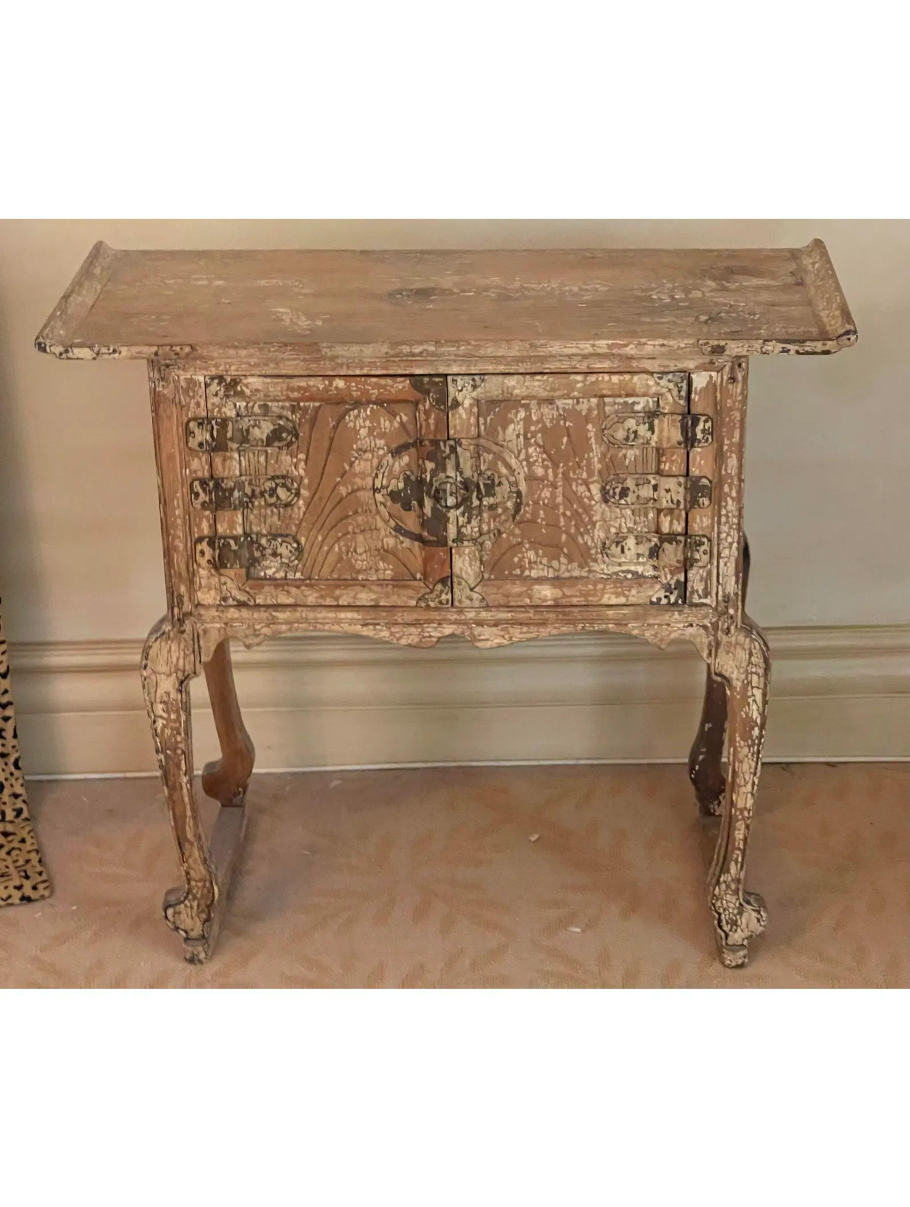 Antique Chinese Ming Style side table with crackle finish. It is beautifully worn with a crackle finish and features two doors and a Ming style form.

Additional information: 
Materials: Wood
Color: Beige
Period: Early 20th Century
Styles:
