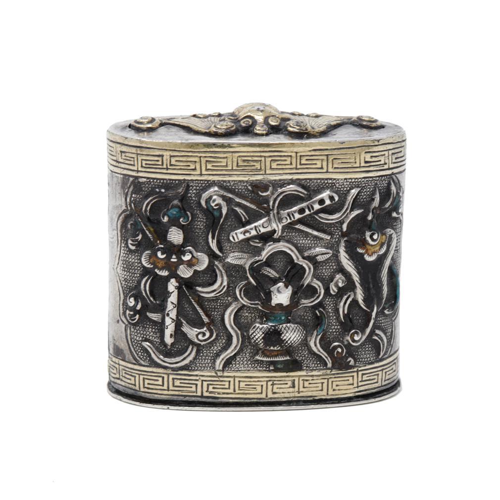 Antique Chinese Mixed Metal and Enamel Opium Box. 
An oval form in three parts consisting of a paktong container with smooth sides and makers mark impressed on the base, a tight fitting paktong lid with a detailed brass bat (symbol of happiness) in