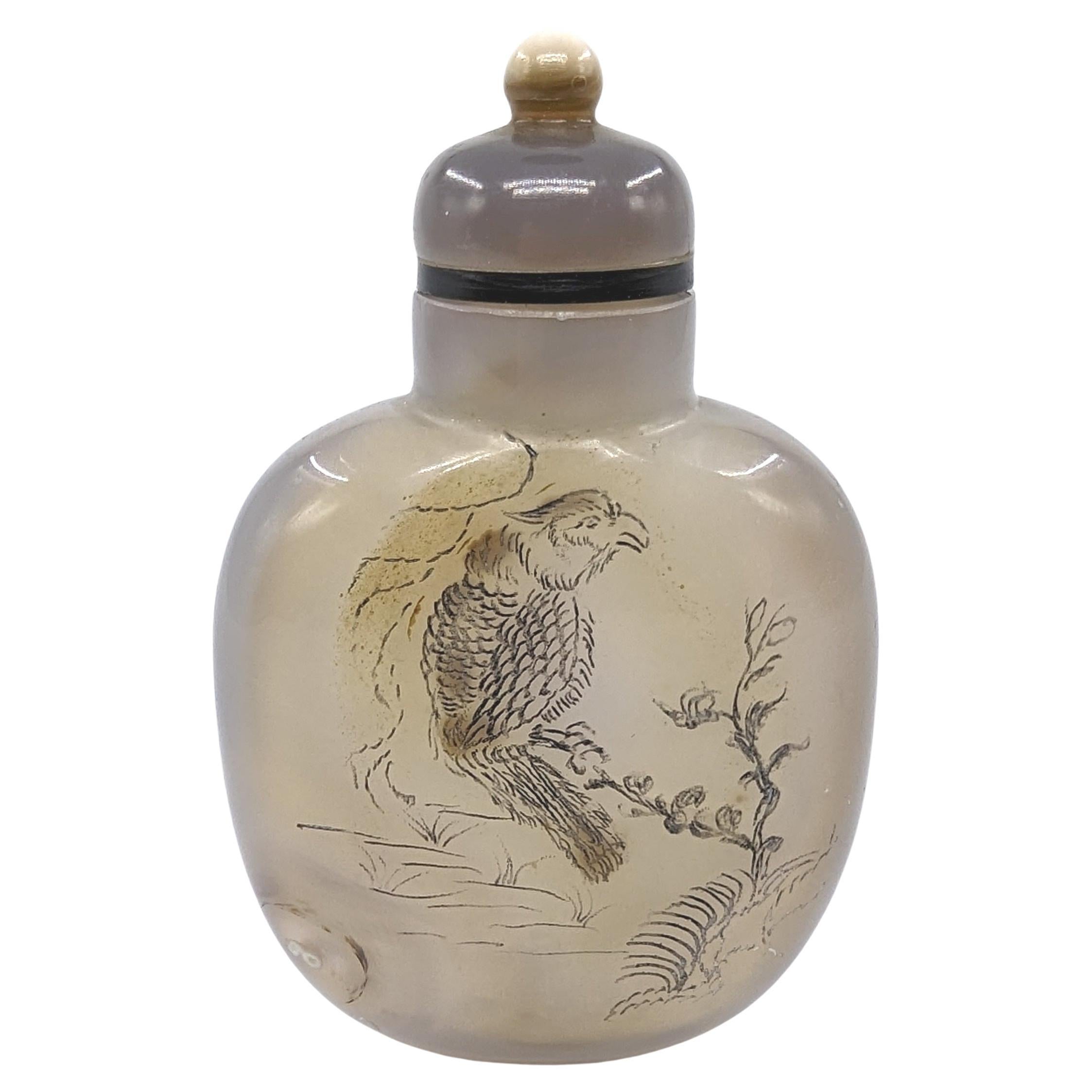Antique Chinese moss agate snuff bottle, with incised and filled decoration of a bird in a garden scene to one side, and natural dendrite formations showing well disbursed moss patterns on the other side. This bottle is well hollowed, with a carved