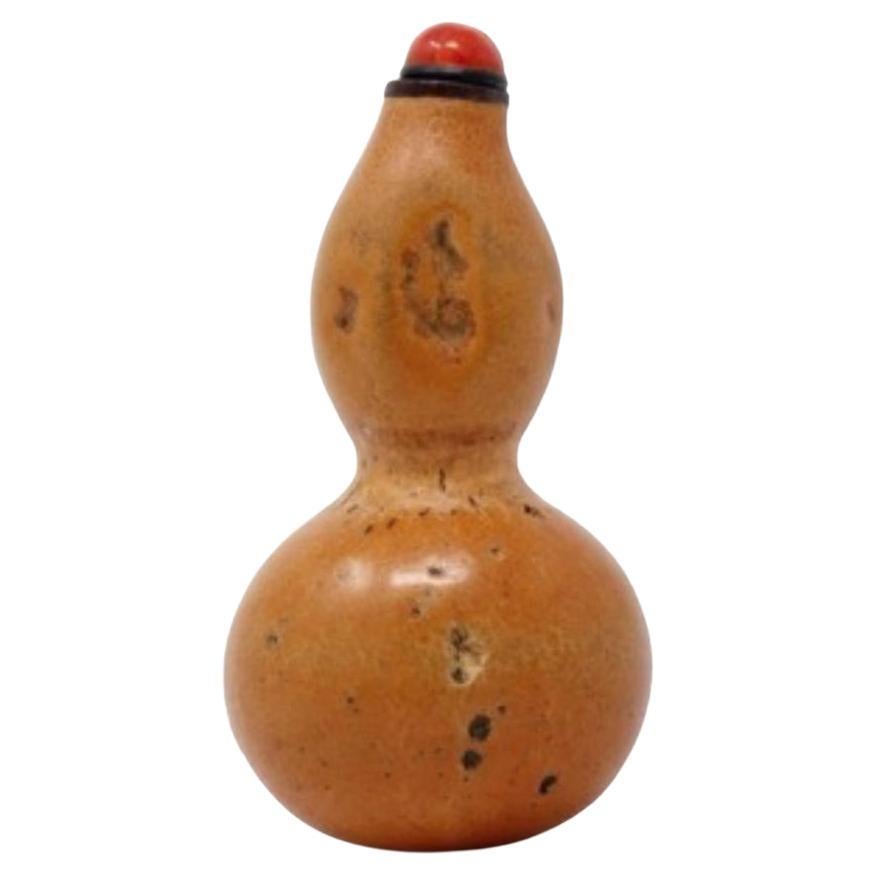 Antique Chinese Natural Double Gourd Snuff Bottle, Qing Dynasty. The long natural gourd is referred to as a double gourd having a cinched waist center with the bulbous  bottom representative of the earth and the smaller bulb on top representative of