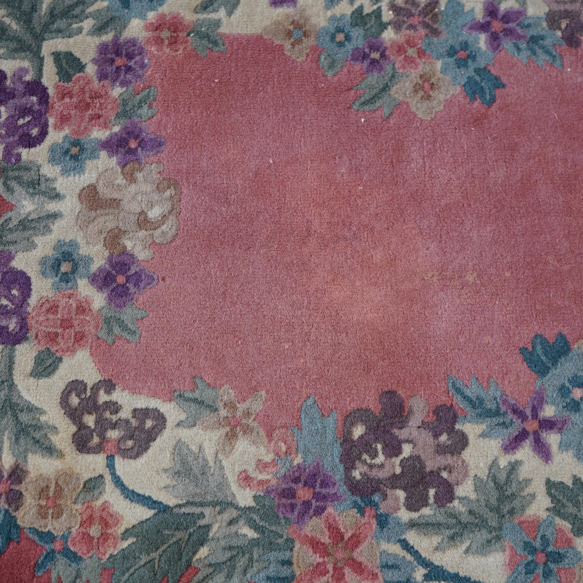 An antique Chinese Art Deco Nichols rug offers wool construction in oval forma with floral border, c1920

Measures- 59''L x 39.5''W x .5''D.

Catalogue Note: Ask about DISCOUNTED DELIVERY RATES available to most regions within 1,500 miles of New