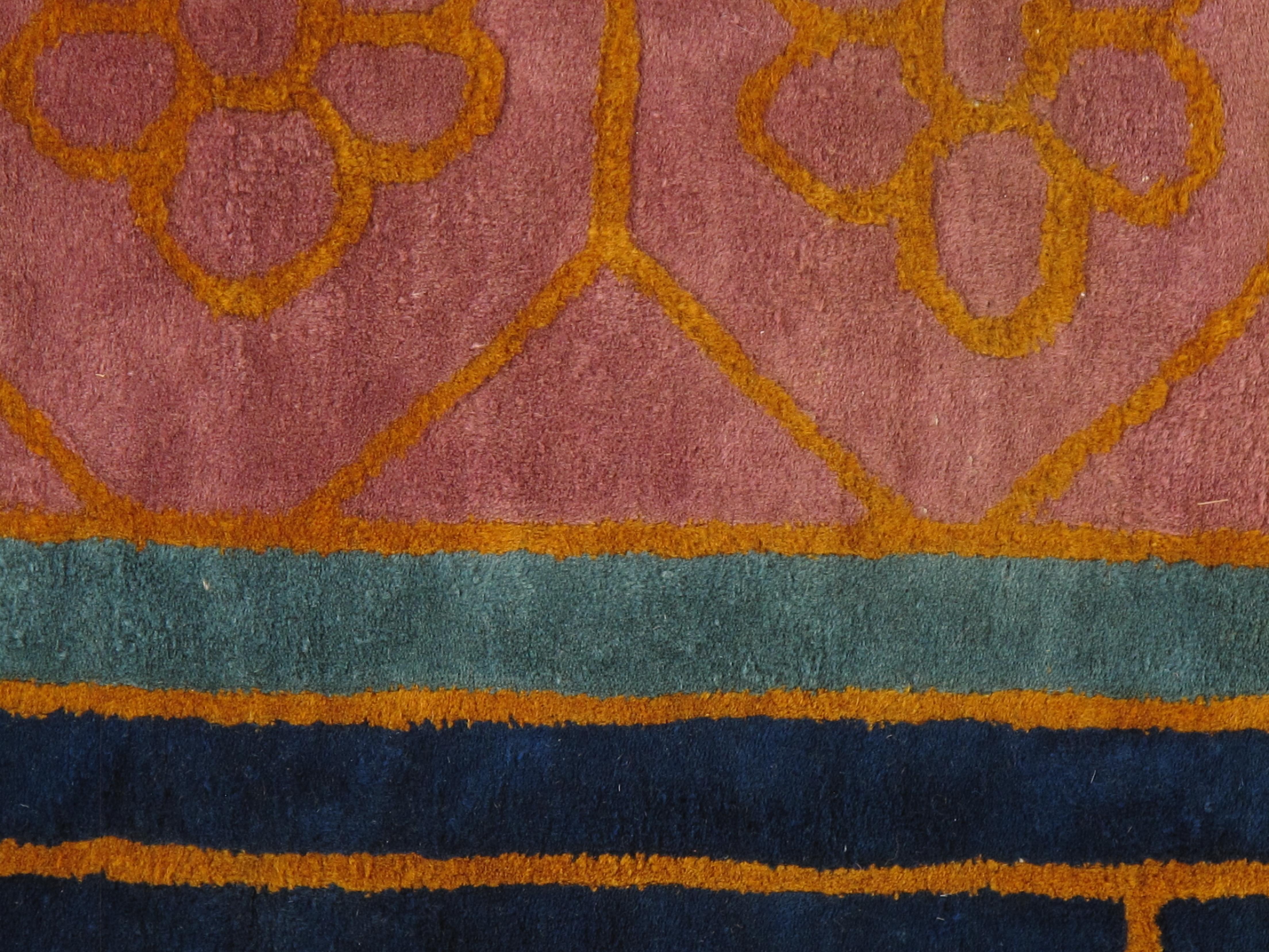 This is an early 20th-century Nichols Chinese carpet, characterized by its vibrant color palette and intricate design elements. The carpet showcases a striking golden-yellow field adorned with elegant floral motifs, including stylized vases with