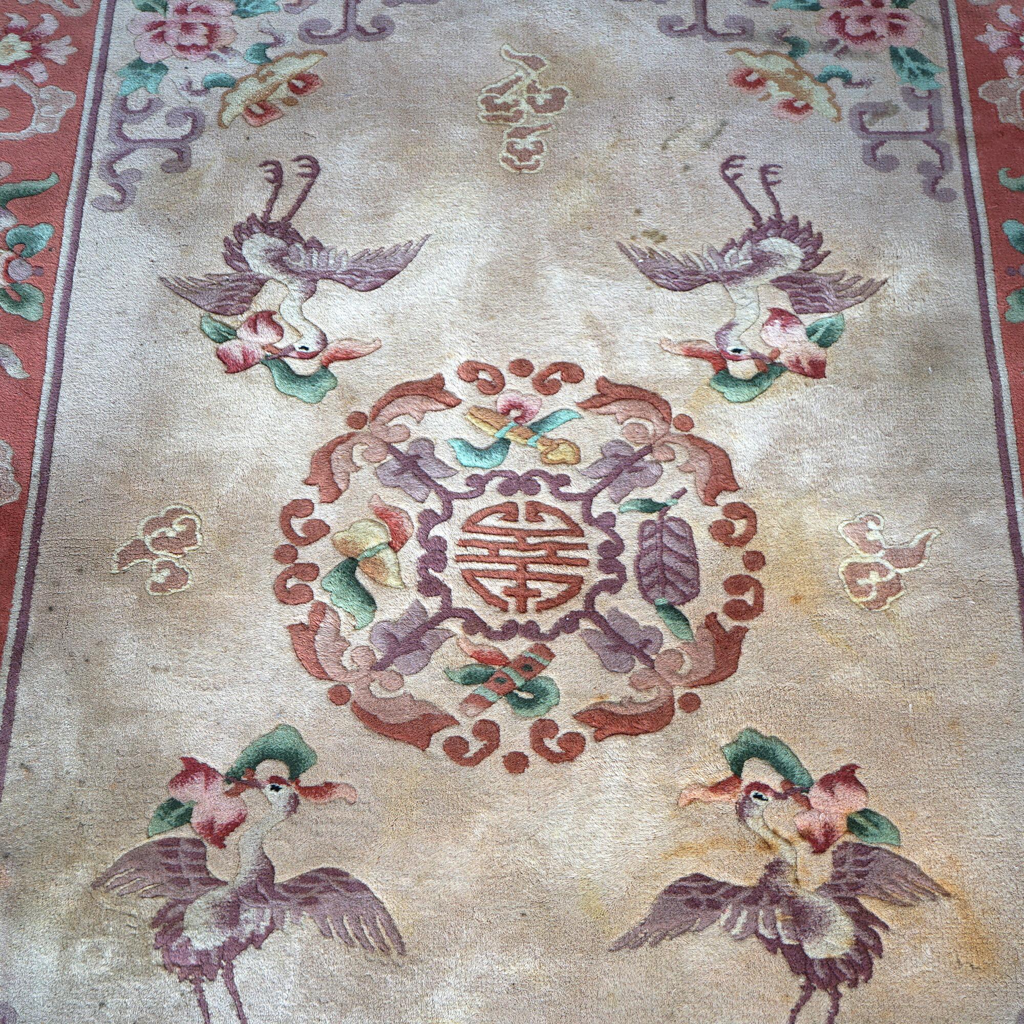 An antique Chinese Nichols oriental rug offers wool construction with central character, floral elements and herons, circa 1930

Measures - 78