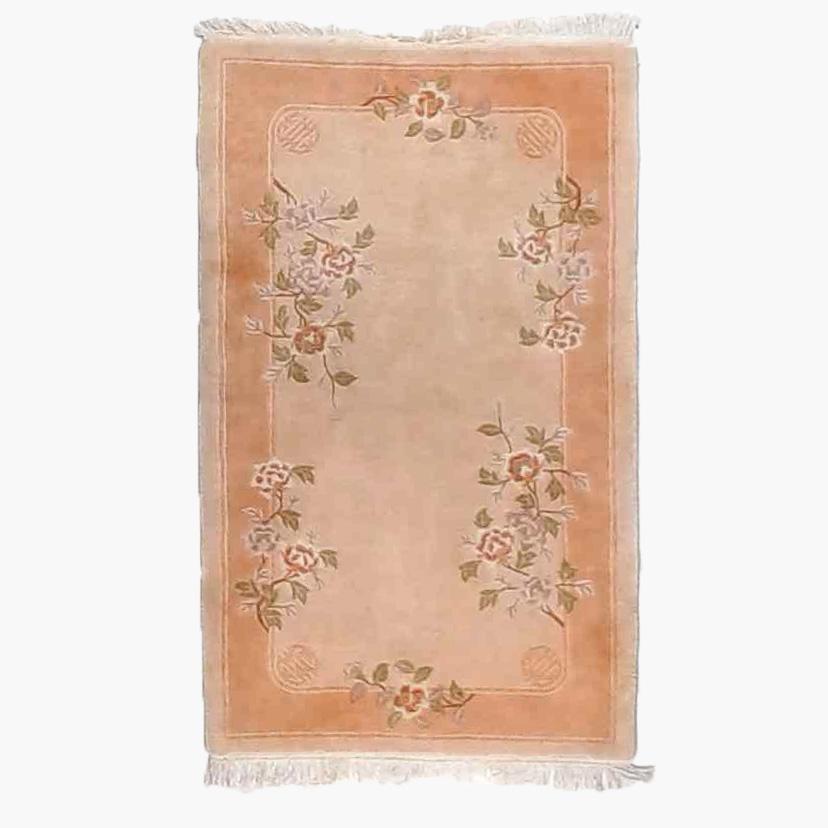 An antique Chinese Nichols oriental throw rug offers wool construction with floral elements, 20th century

Measures - 69