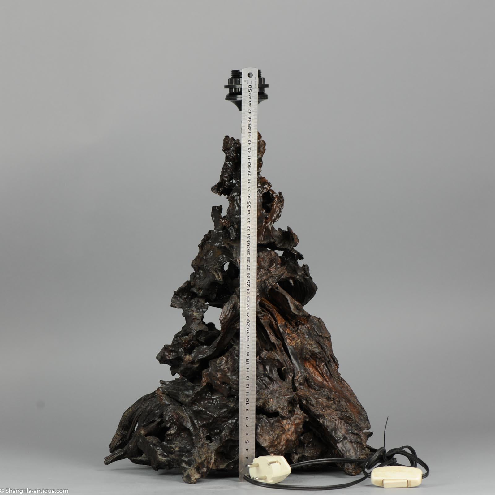 Large and beautifully hand carved wooden Lamp Vase. It is broken in 2 and seems to have been painted or pickled.

Additional information:
Material: Wood / Bamboo
Type: Vase
Region of Origin: China
Period: 20th century
China Dynasty Period: PRoC