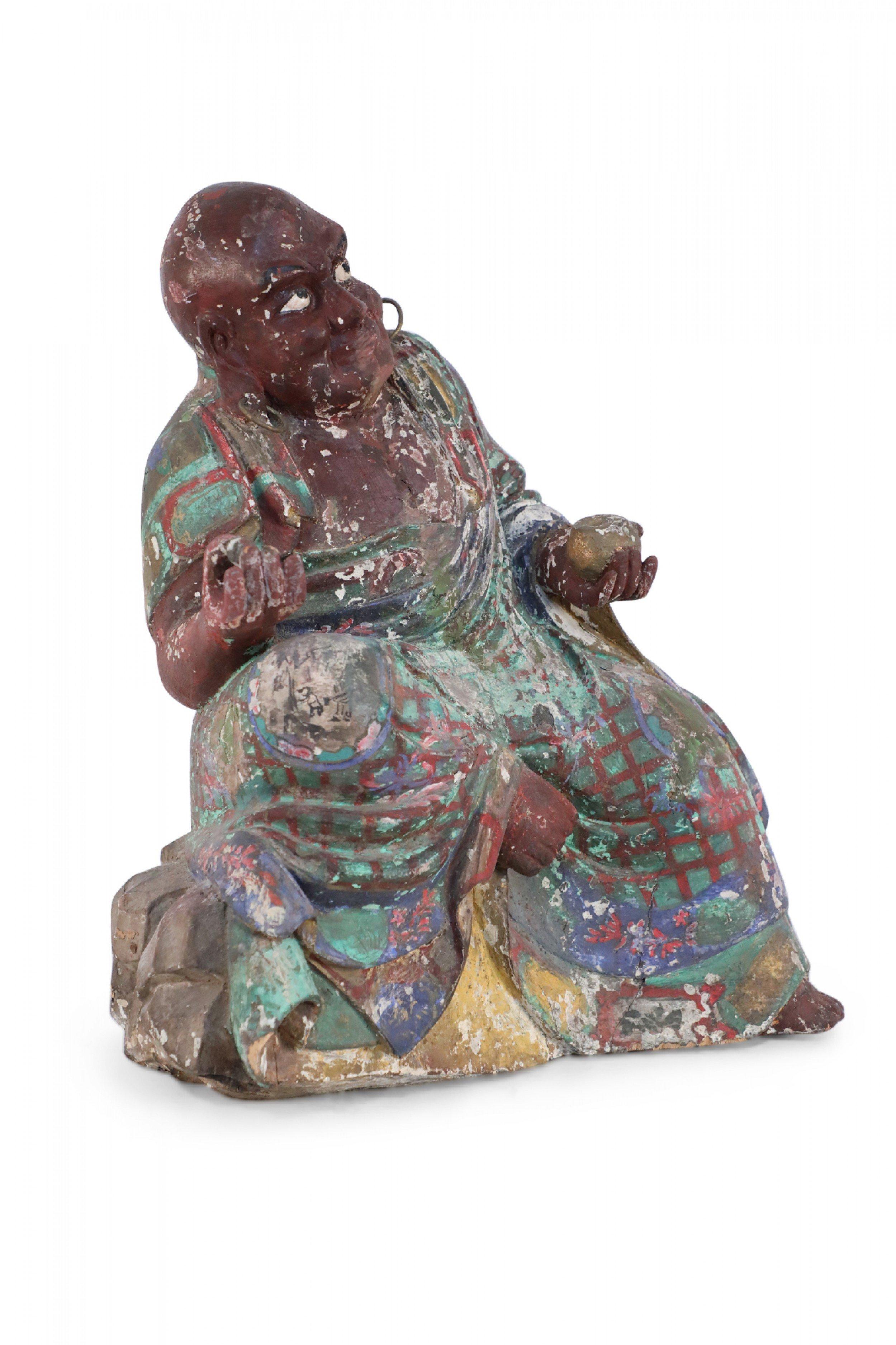 Antique Chinese (early 20th Century, Republic of China) clay Buddha sculpture with painted details in green, brown, and blue.
 